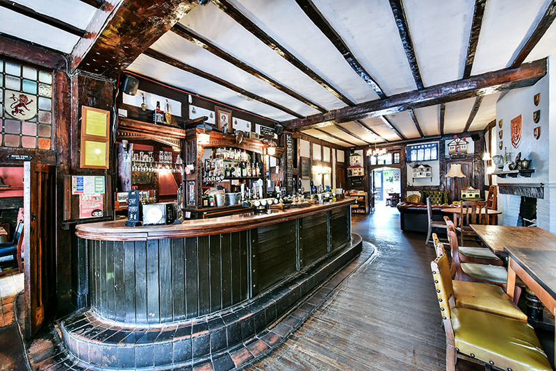 Rustic bar area in Red Room, The Old Red Lion, ideal for intimate gatherings and networking.