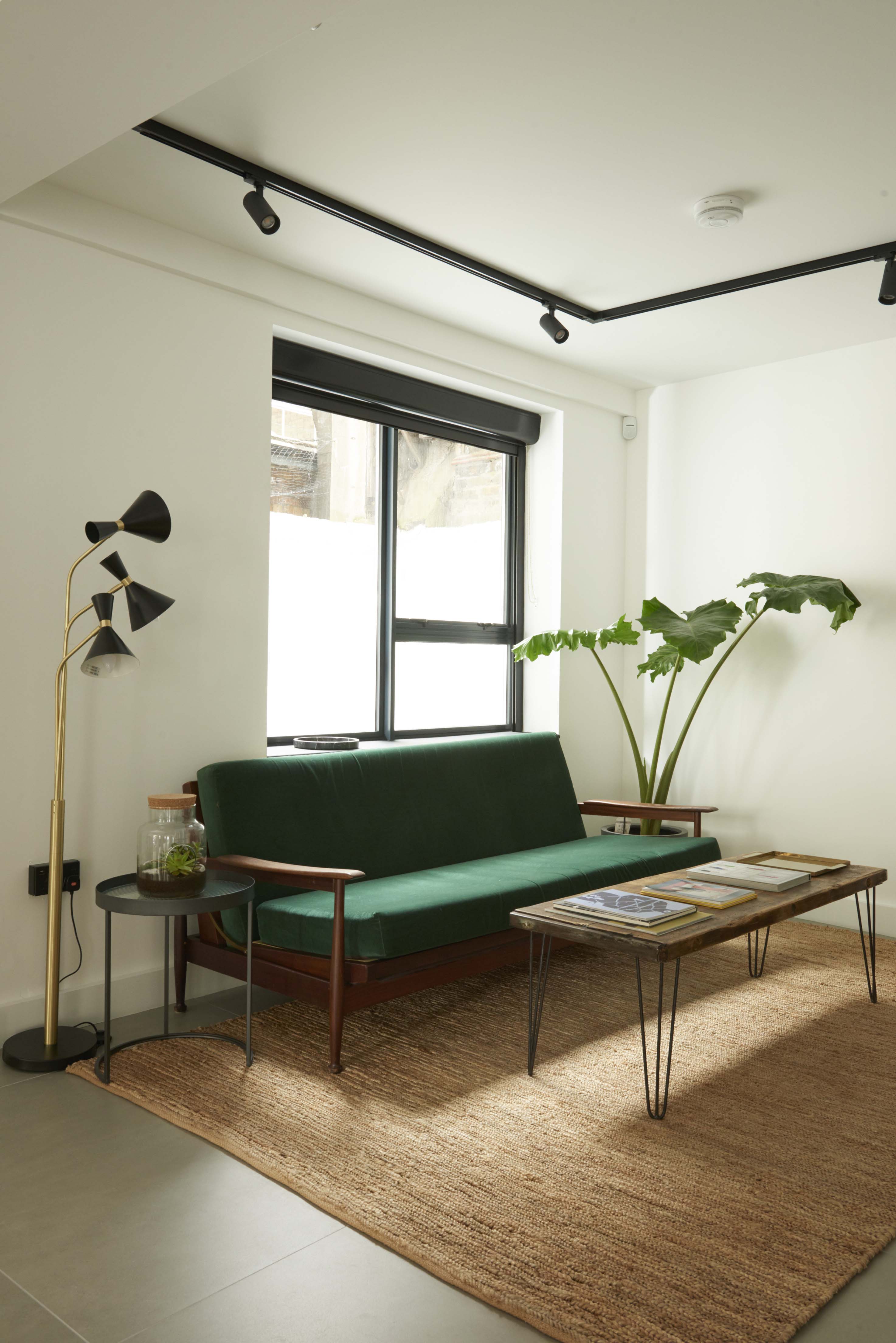 Stylish lounge at Agdon House with green sofa, ideal for networking events.