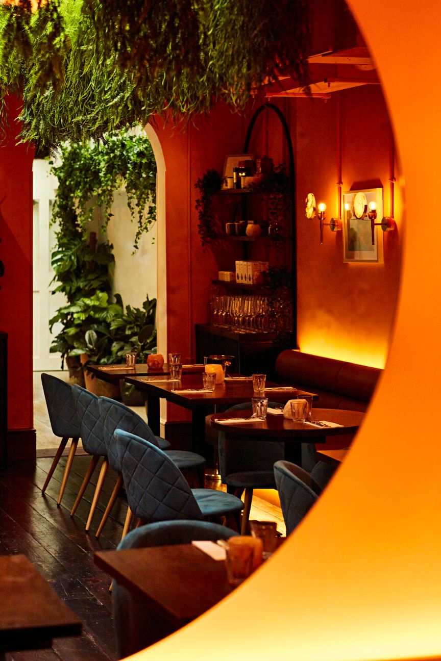 Lilly's Cafe dining space with warm lighting, ideal for networking dinners and private events.