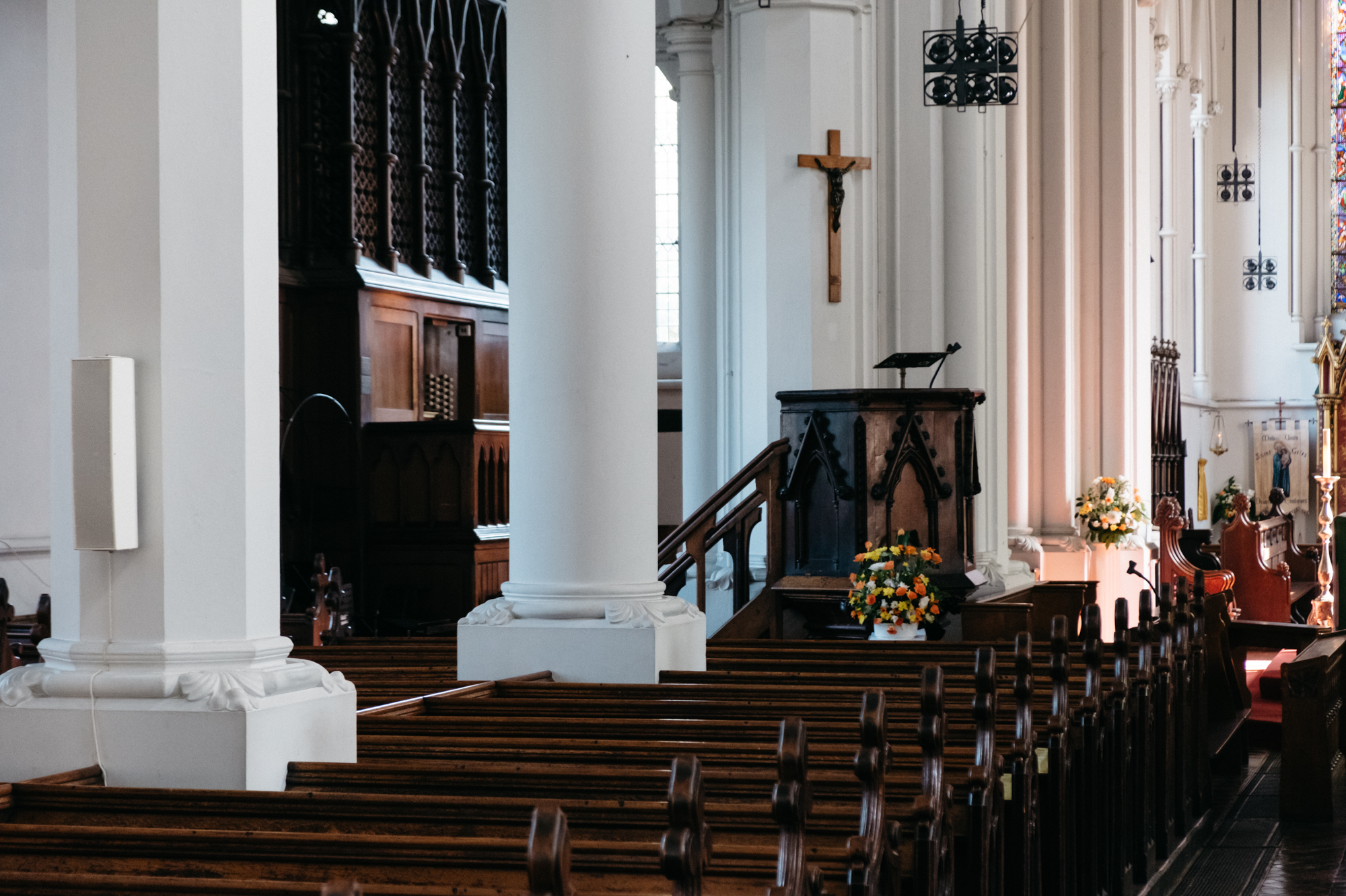 St Giles Camberwell church interior with wooden pews, perfect for ceremonies and gatherings.