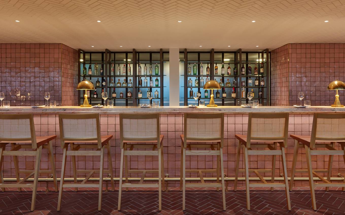 Rooftop Bar at One Hundred Shoreditch Hotel with pink tiles, ideal for networking events.