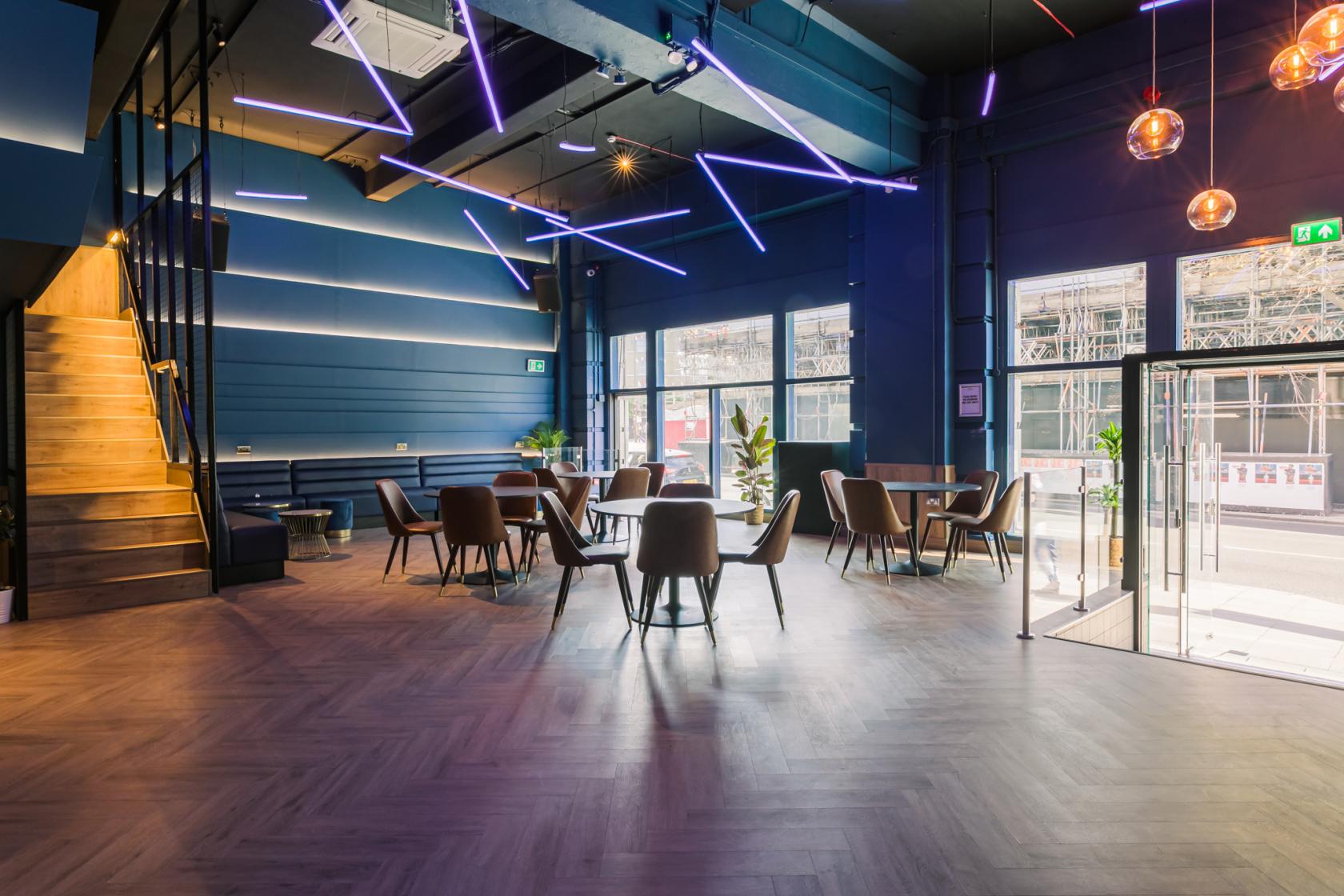 Modern event space at Main Bar, The Camden, with stylish decor and vibrant lighting.