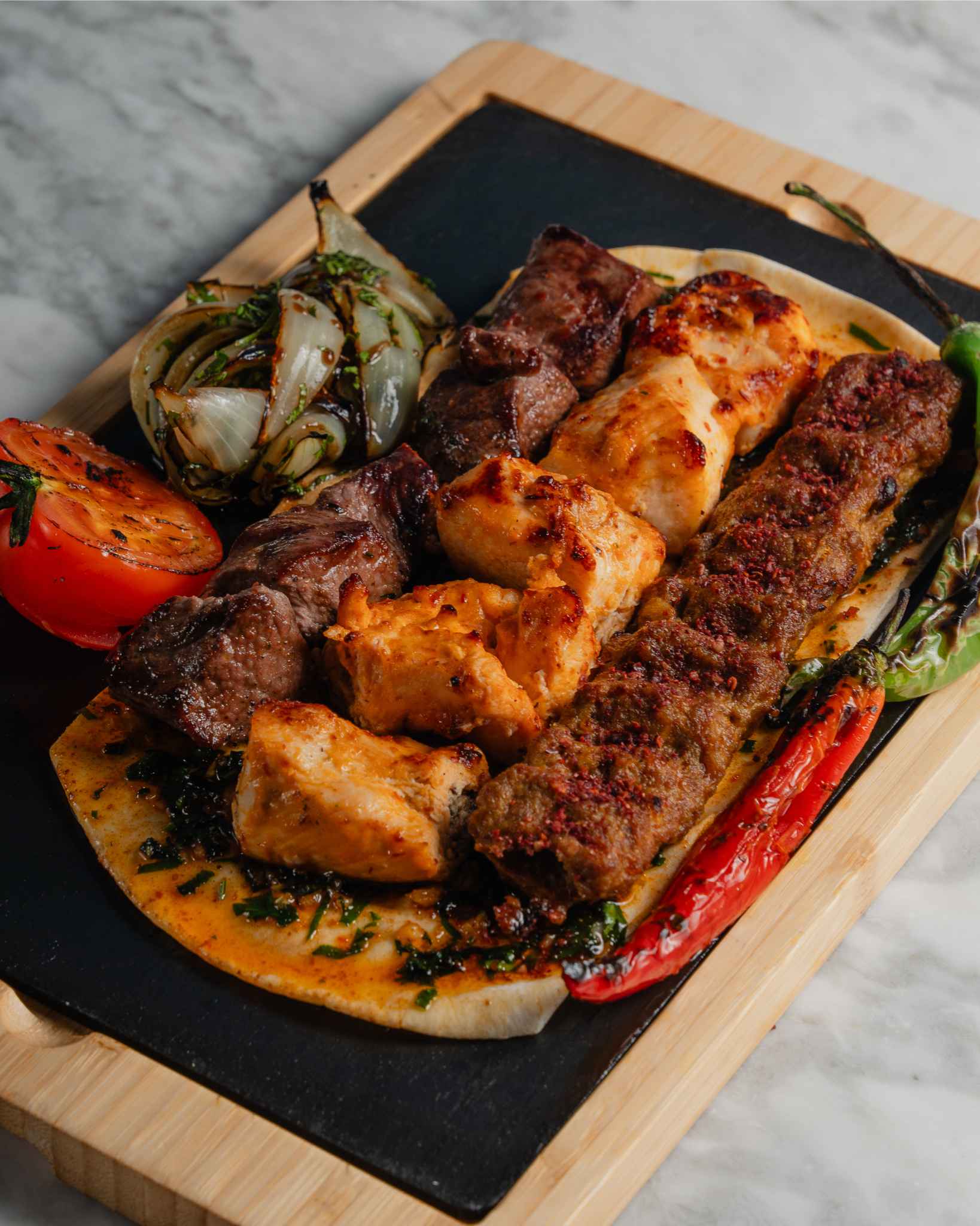 Grilled meat platter at Mezemiso Rooftop Restaurant, ideal for events and catering.