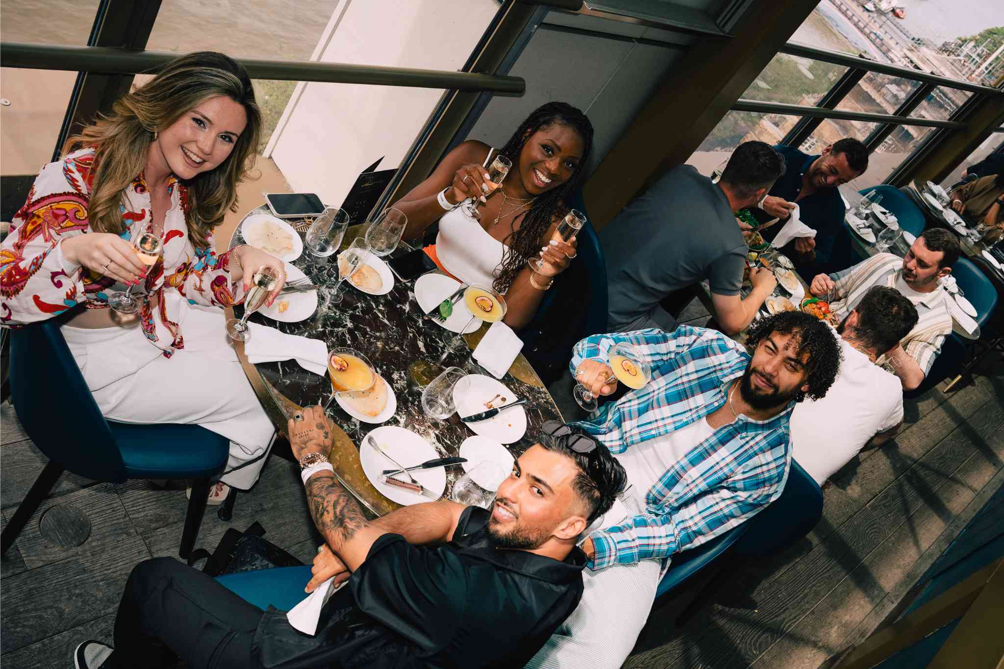 Vibrant group dining at Mezemiso Rooftop Restaurant, ideal for networking events and gatherings.