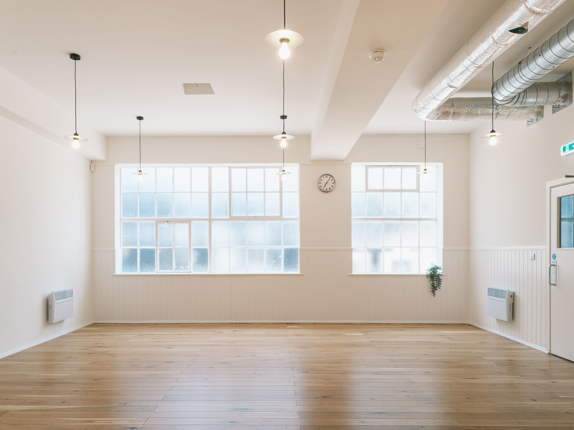 Versatile meeting space with natural light in King's House for workshops and private dining.