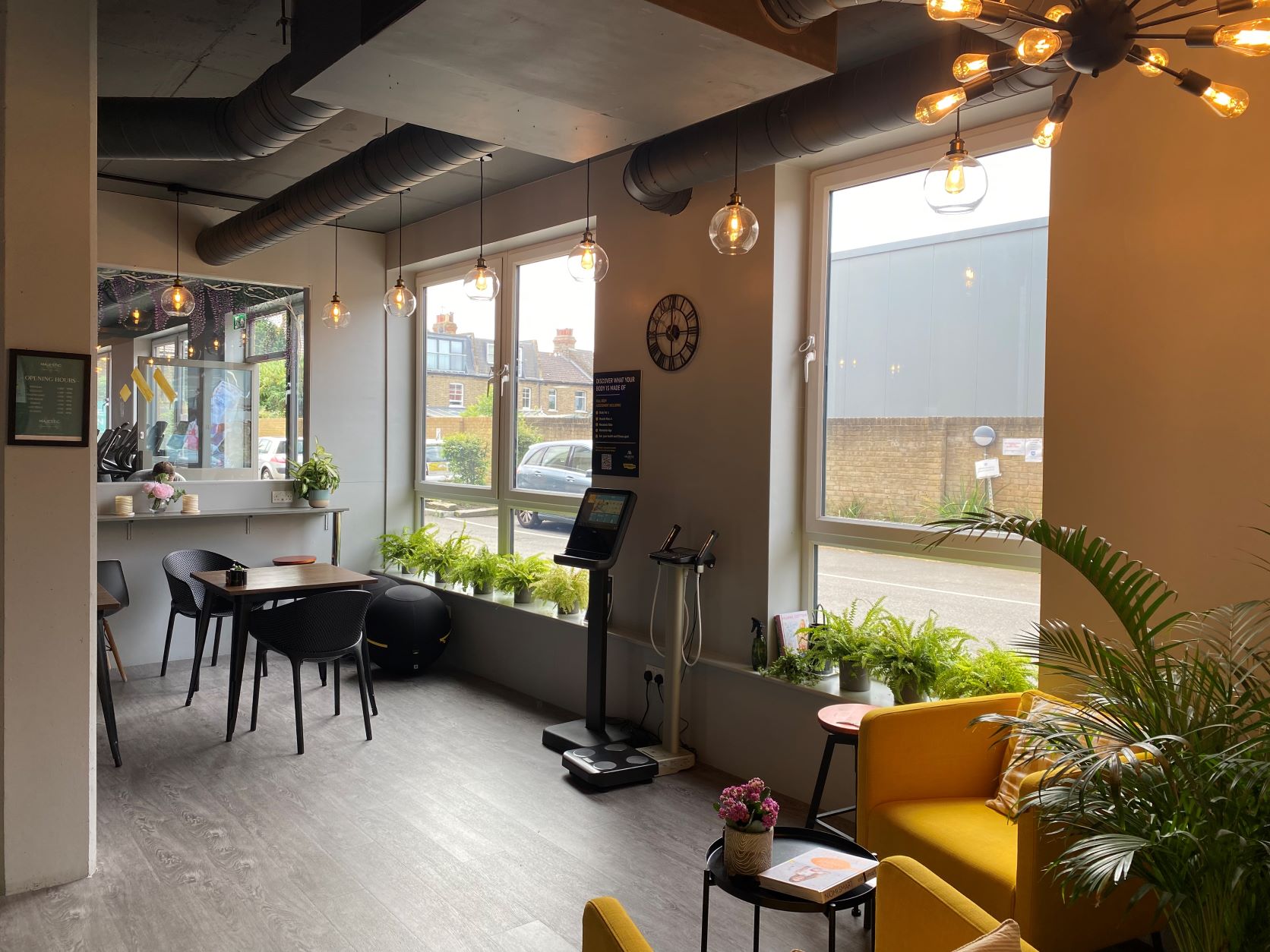 Modern gym space with natural light, ideal for casual meetings and events.