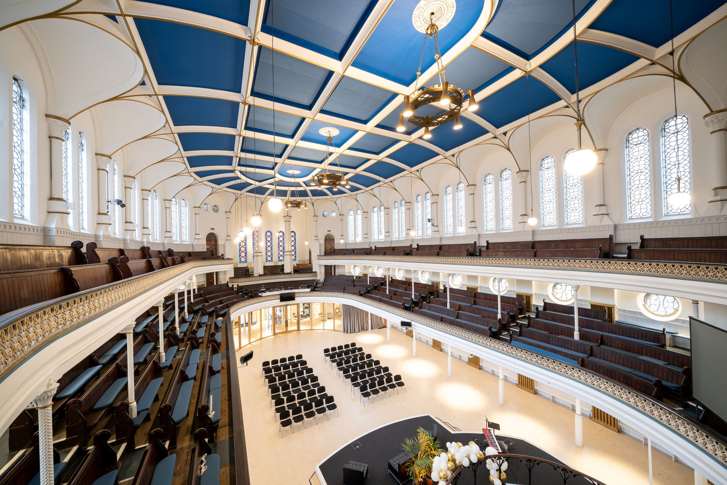 Elegant Westminster Chapel auditorium with tiered seating for events and conferences.