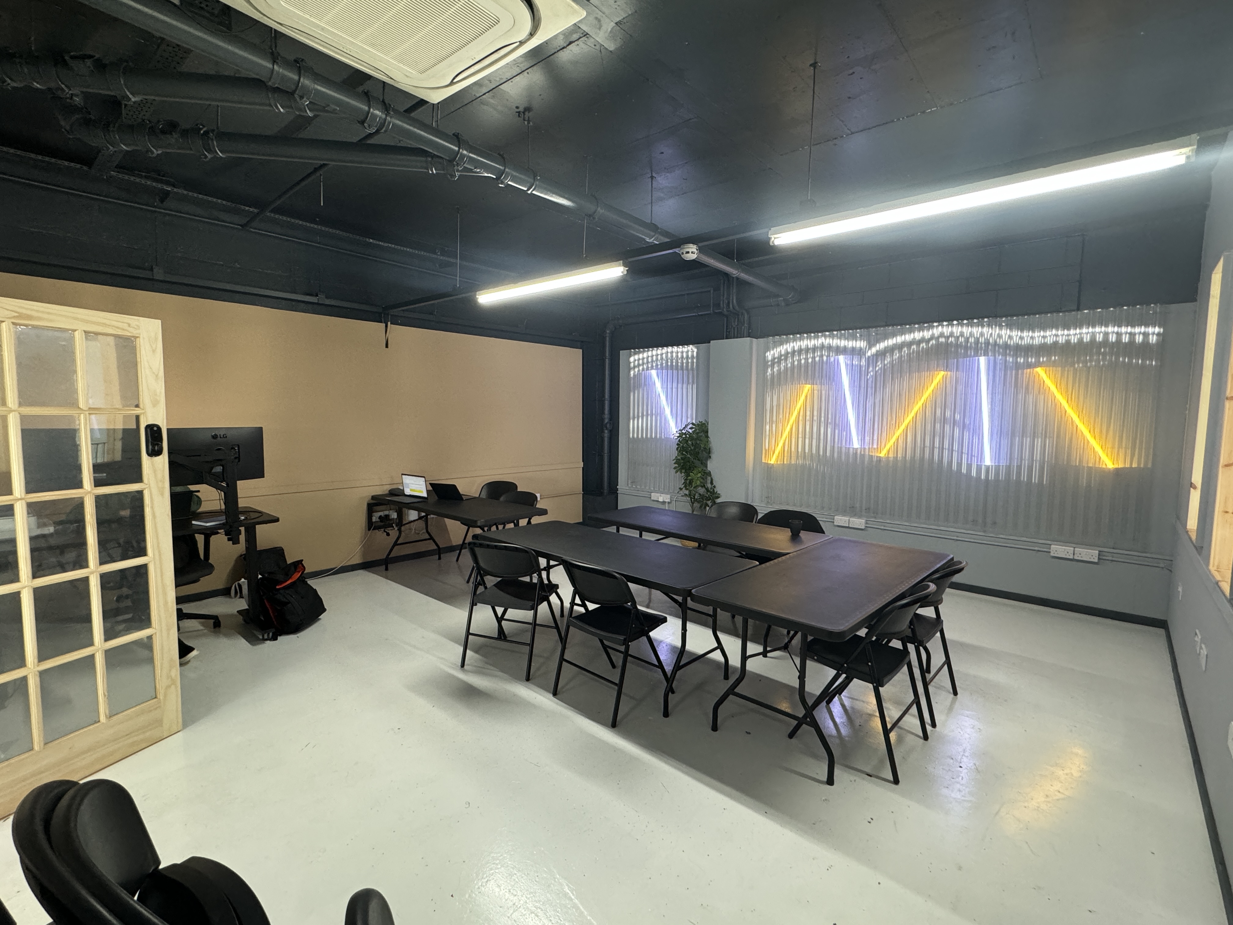 Modern meeting space at Royal Albert Wharf, ideal for workshops and presentations.