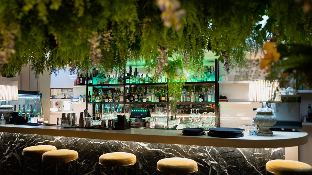 Stylish Garden Rooftop bar with marble counter, ideal for networking events and cocktail receptions.