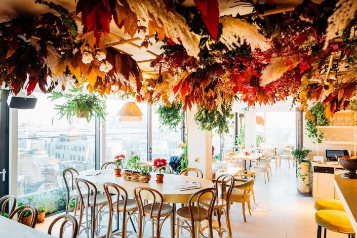 Garden Rooftop venue with floral ceiling, perfect for events and gatherings.
