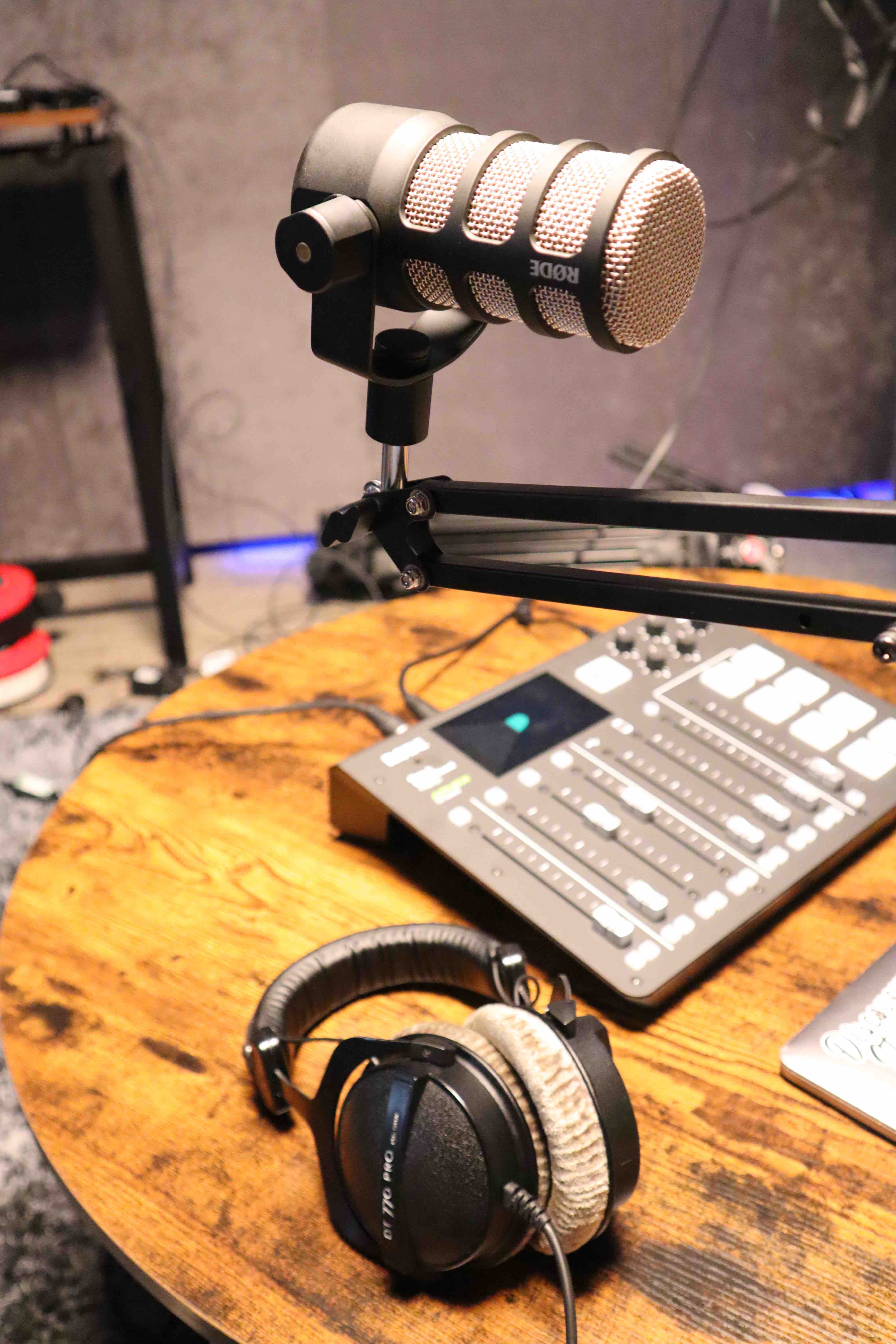 Professional audio mixing console and microphone for high-quality sound production events.