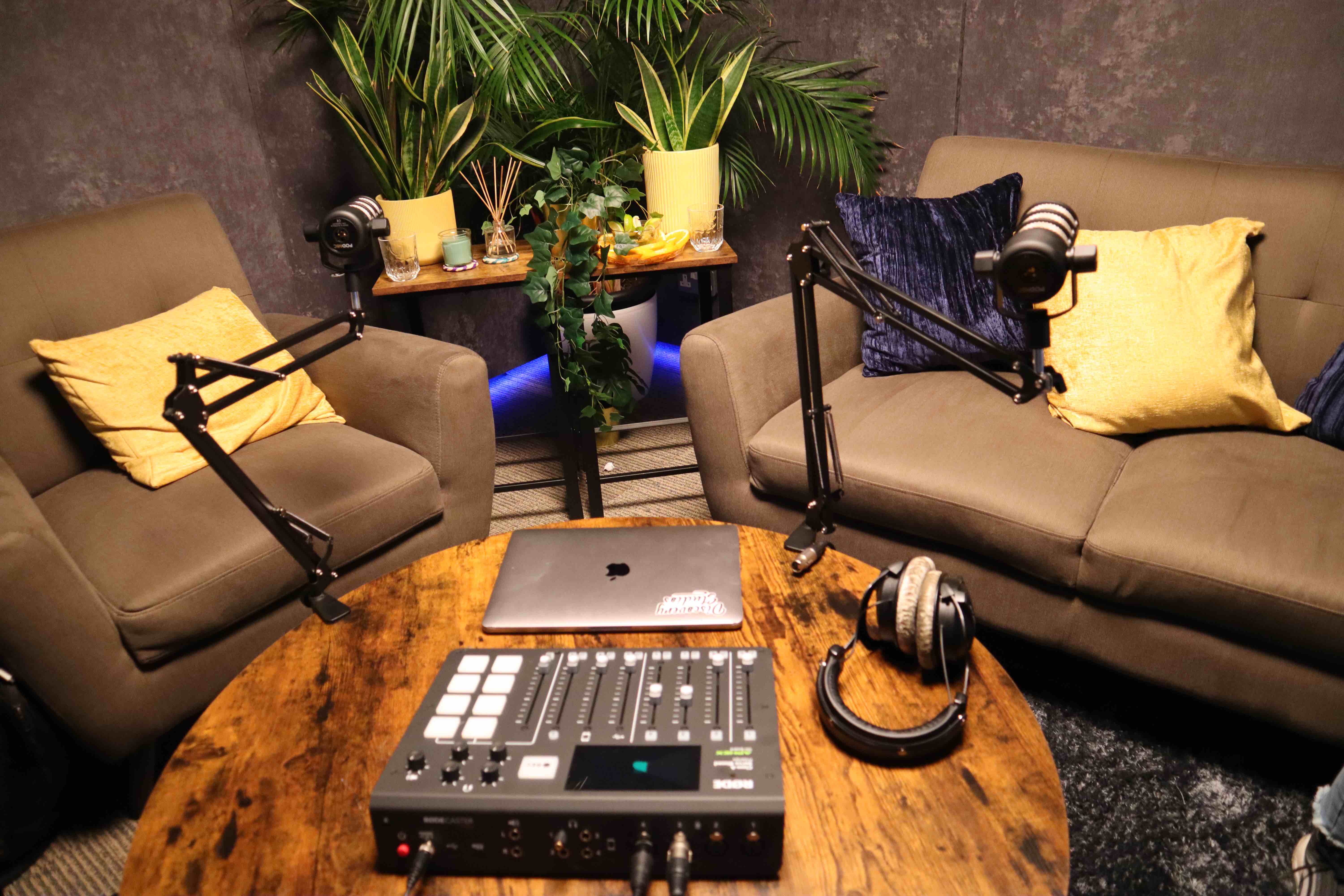 Cozy podcasting setup with professional audio equipment for intimate interviews.