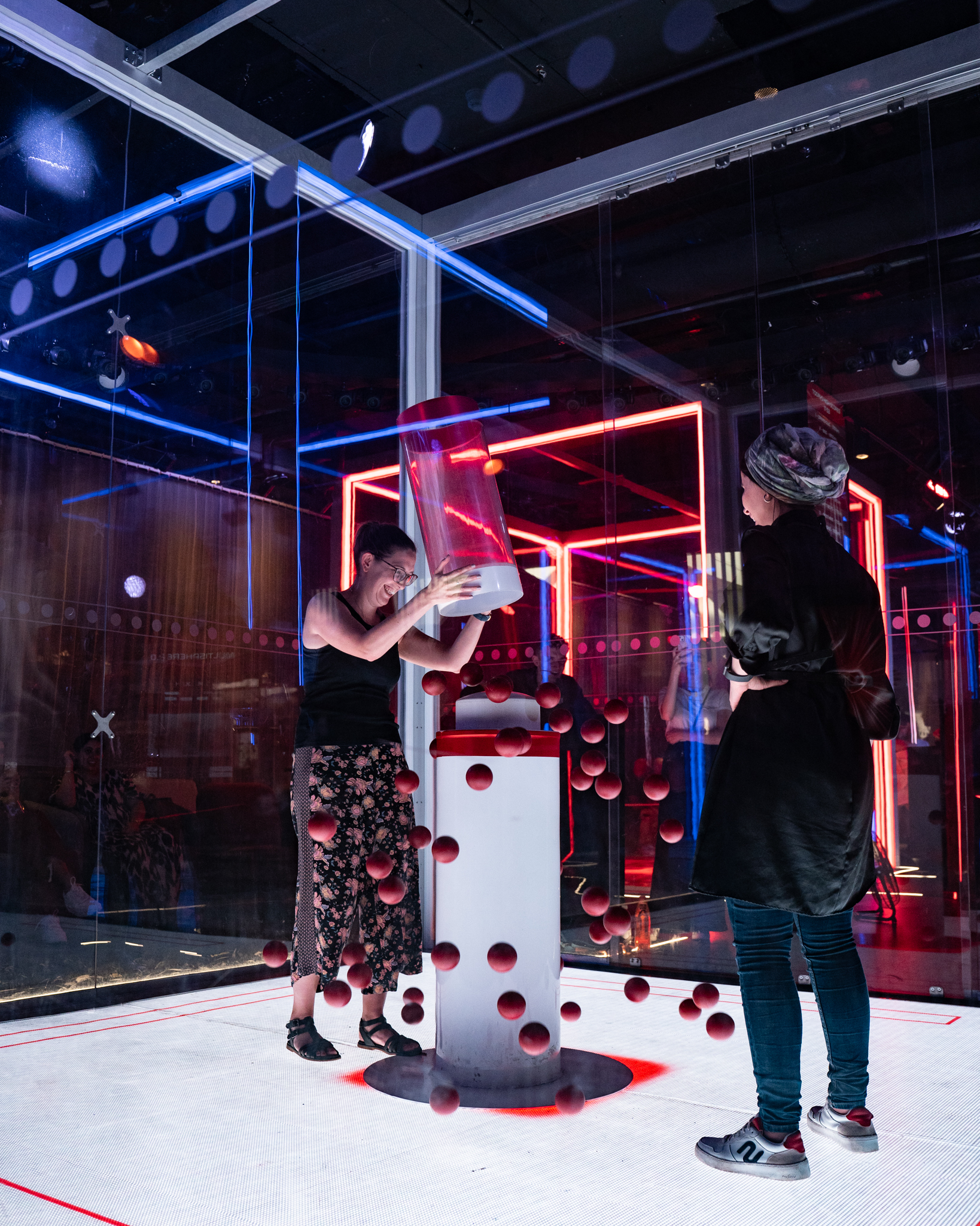 Interactive CUBE Live Experience installation for team-building events with vibrant lighting.