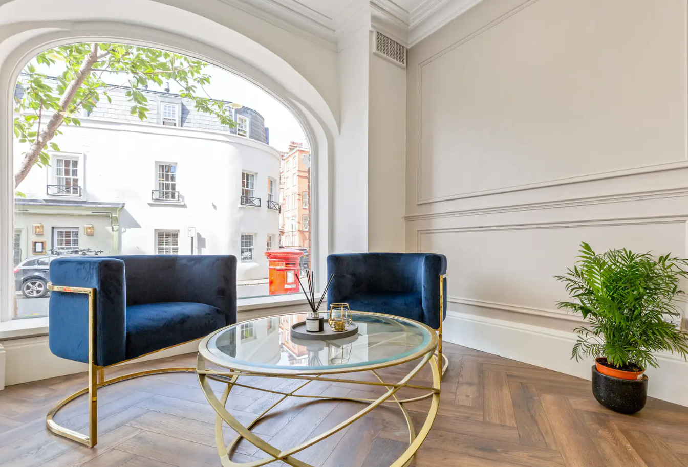 ACG Meeting Room with blue chairs, ideal for networking and small group meetings.
