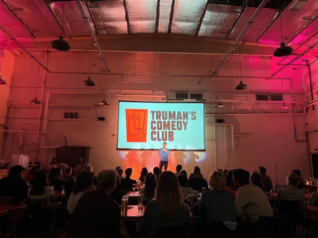 Vibrant comedy club stage at Big Penny Social, ideal for engaging entertainment events.