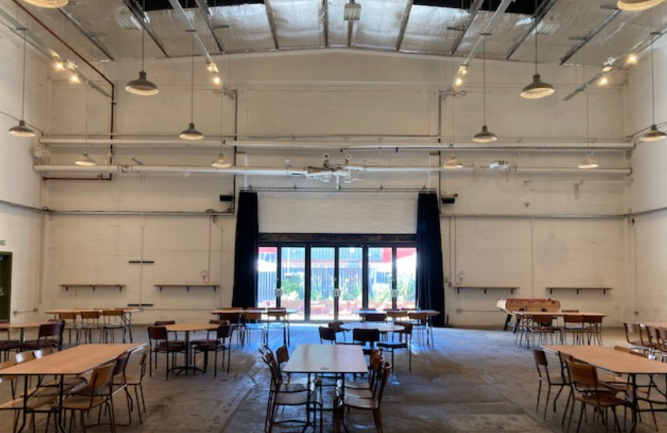 Spacious event space with natural light, ideal for workshops and networking events.