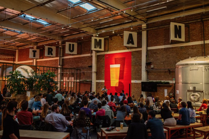 Vibrant event space at Big Penny Social with industrial decor for networking and gatherings.