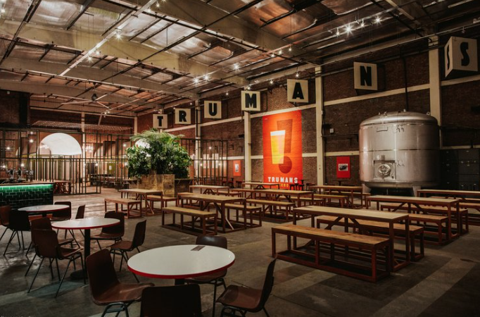 Versatile event space with industrial vibe, ideal for corporate events and gatherings.