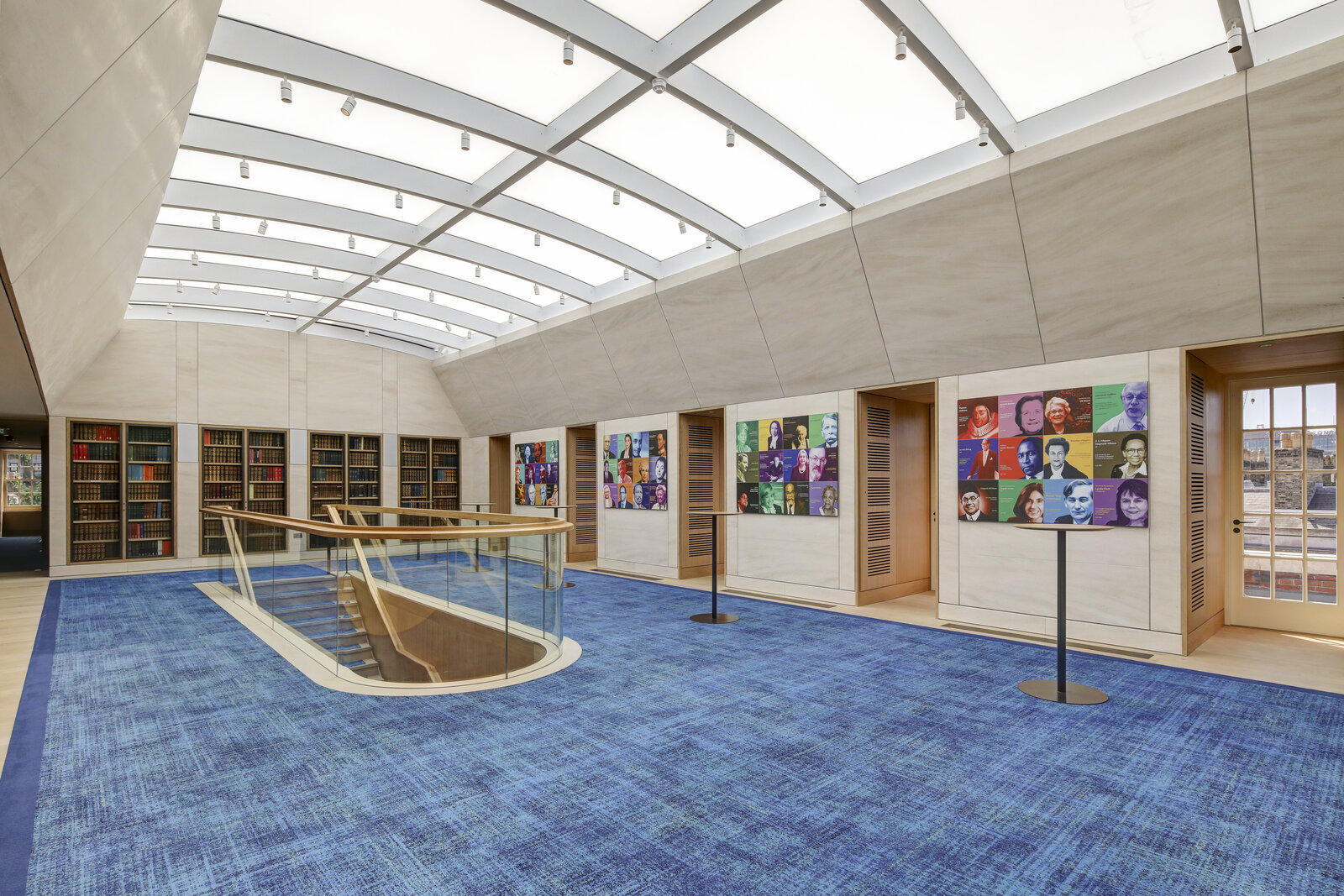 Modern event space with large windows and vibrant artwork, ideal for networking events.