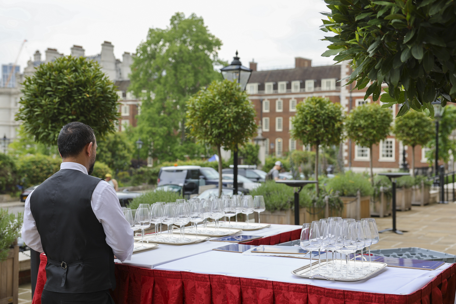 Elegant outdoor event setup at The Terrace, featuring lush greenery and sophisticated service.