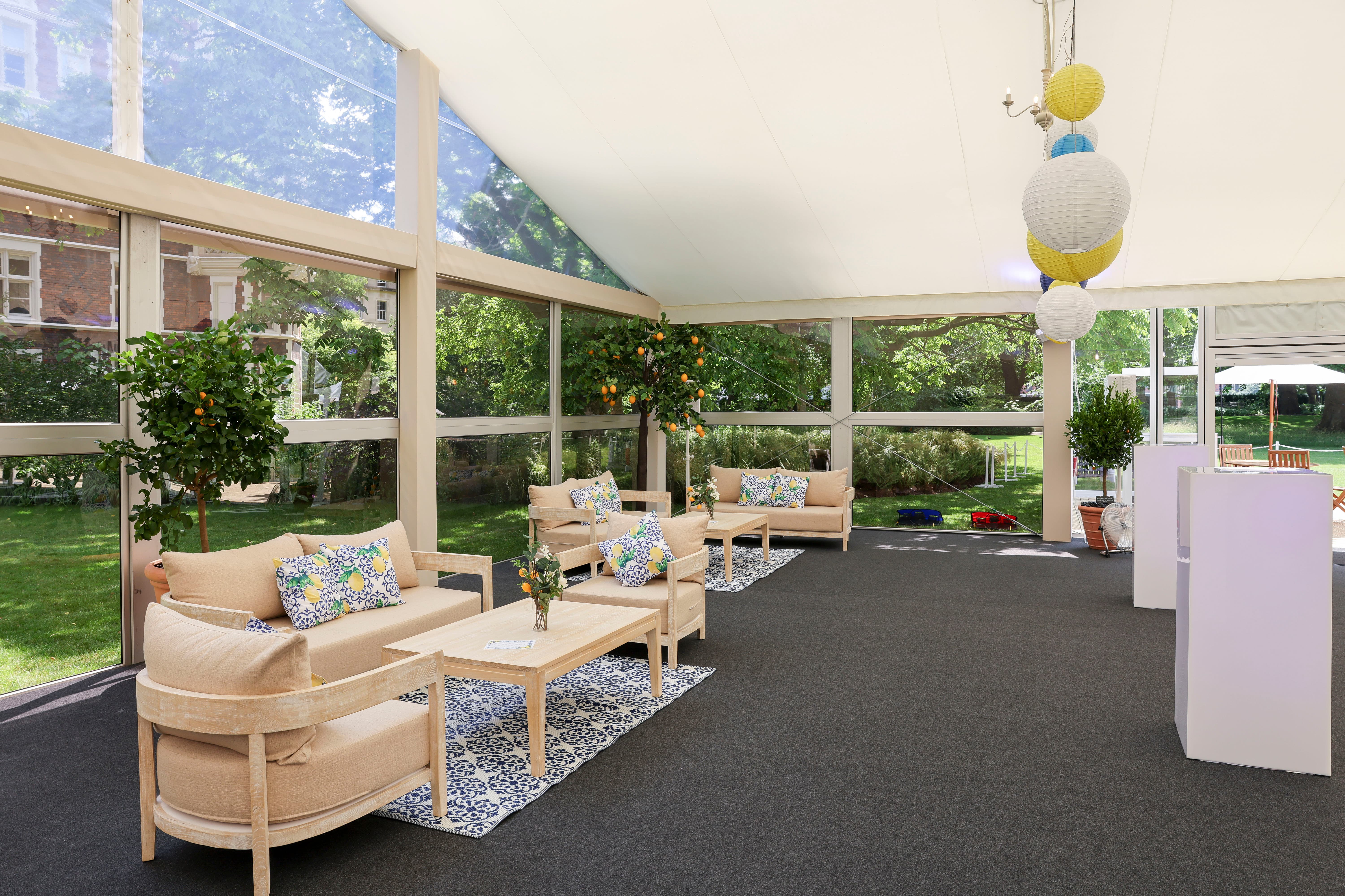 Modern garden lounge with modular furniture for corporate events and wedding cocktails.