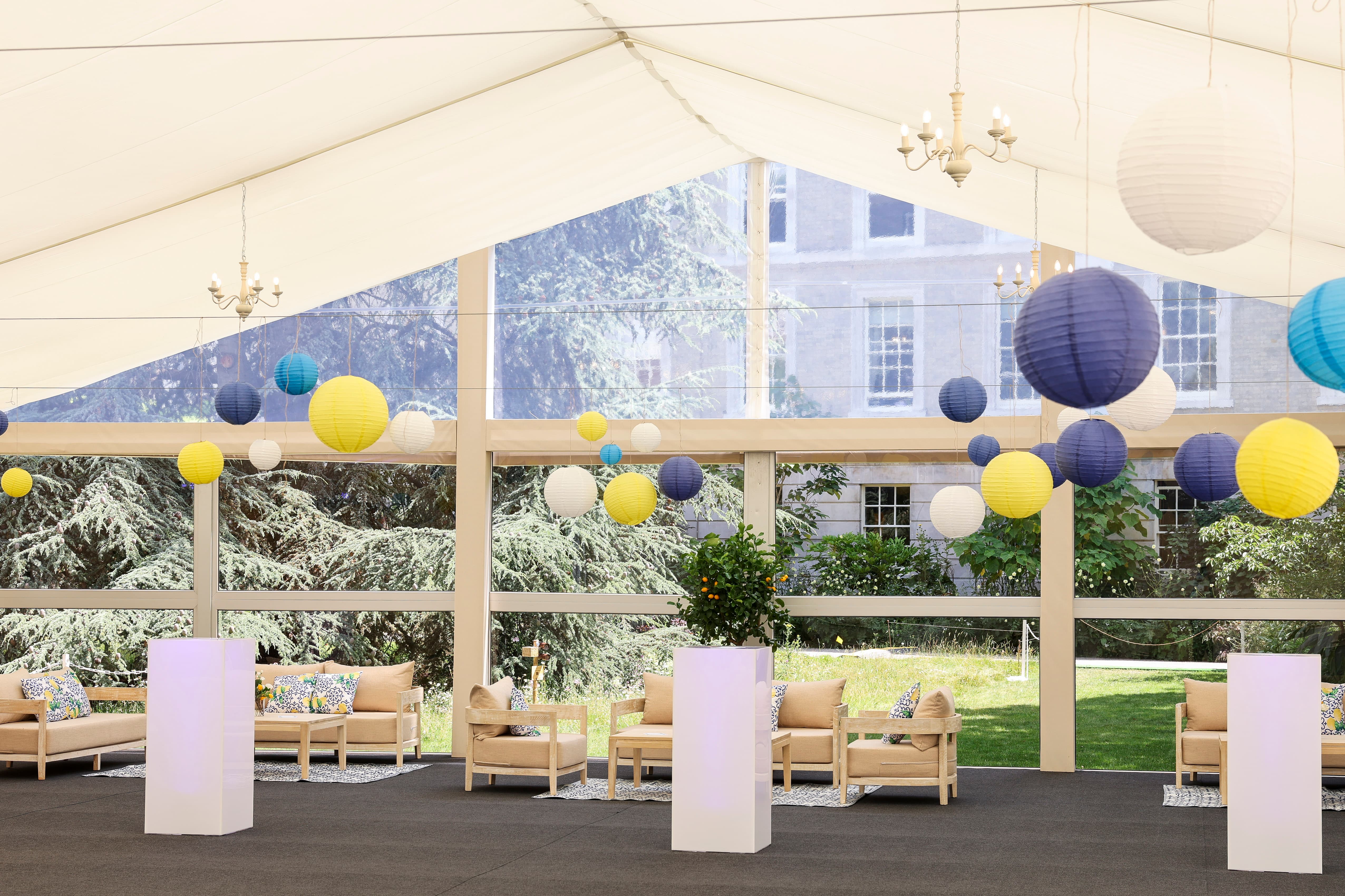 Marquee reception in The Garden at Inner Temple with lounge seating and lantern decor.