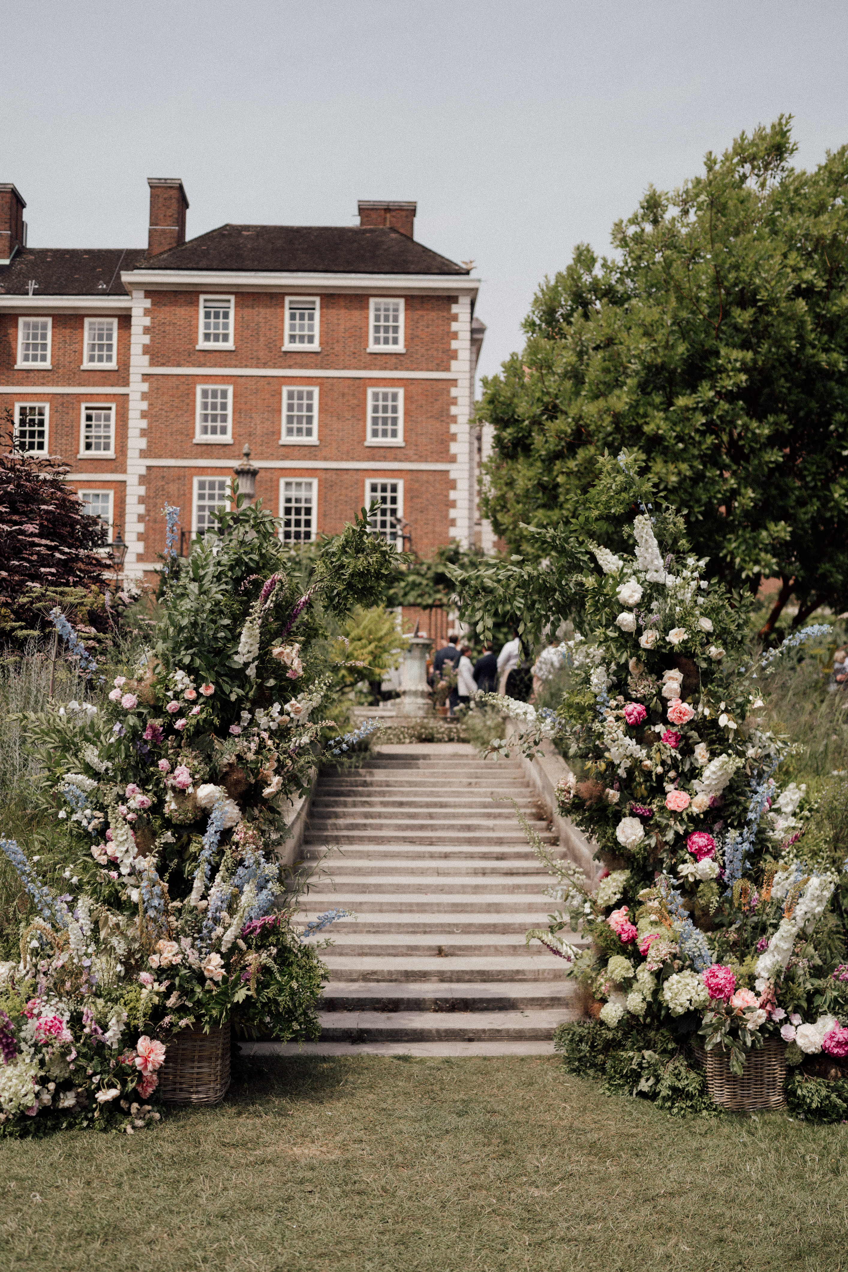 Elegant garden venue with floral arrangements, ideal for weddings and parties.