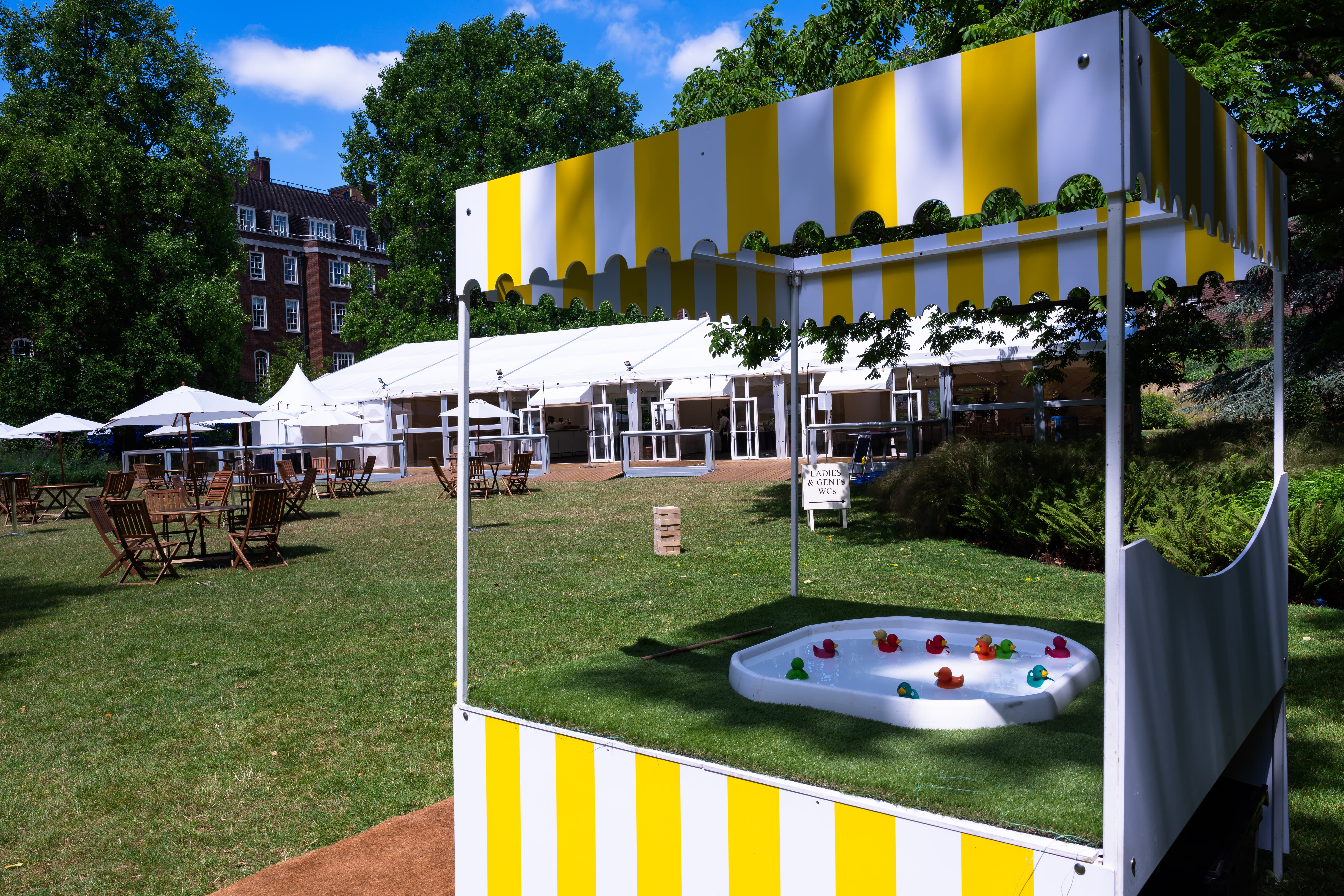 Corporate family day event setup at The Garden, Inner Temple with carnival games and marquees.
