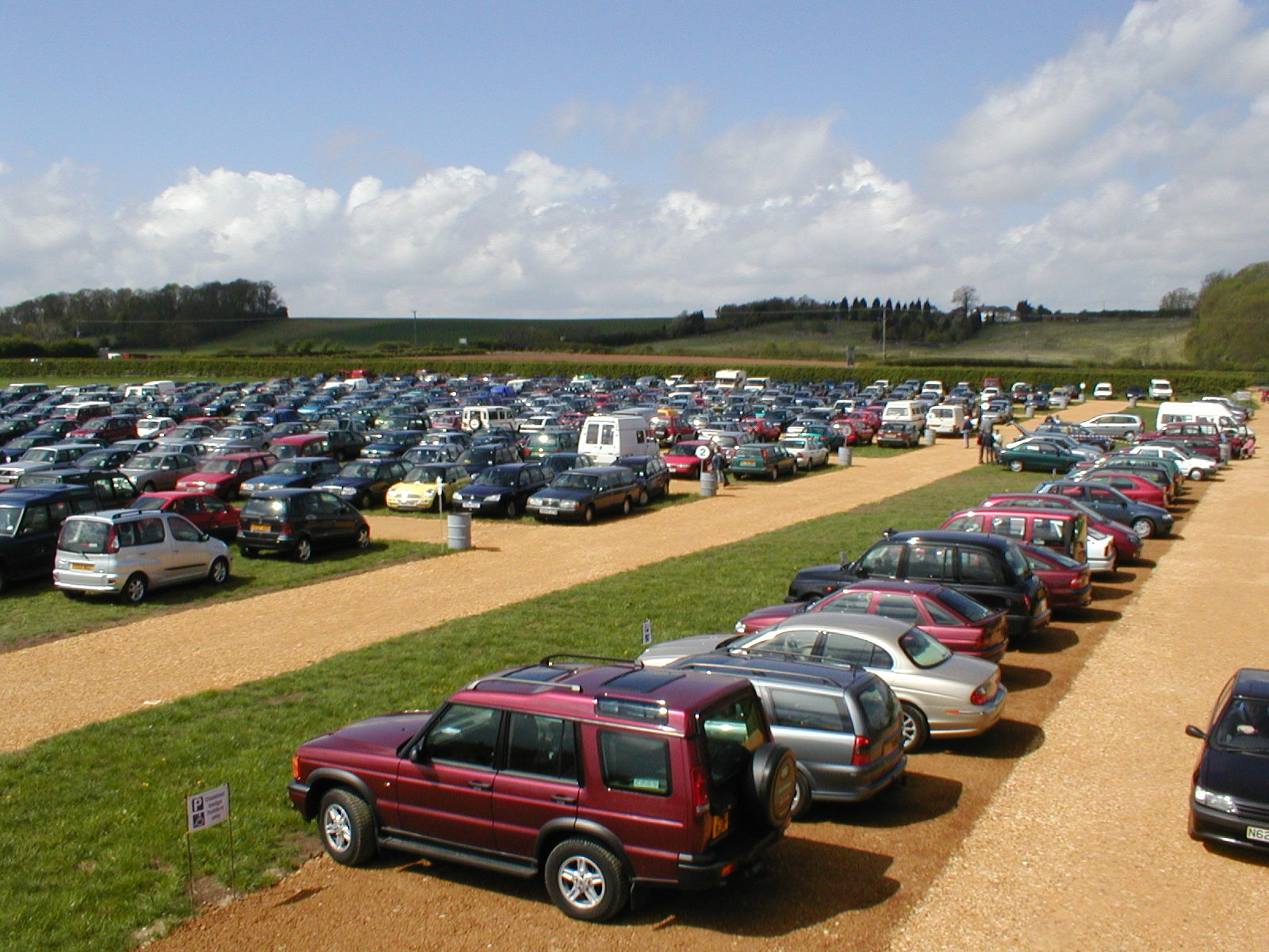 Warwickshire Event Centre parking lot bustling with vehicles during a successful event.
