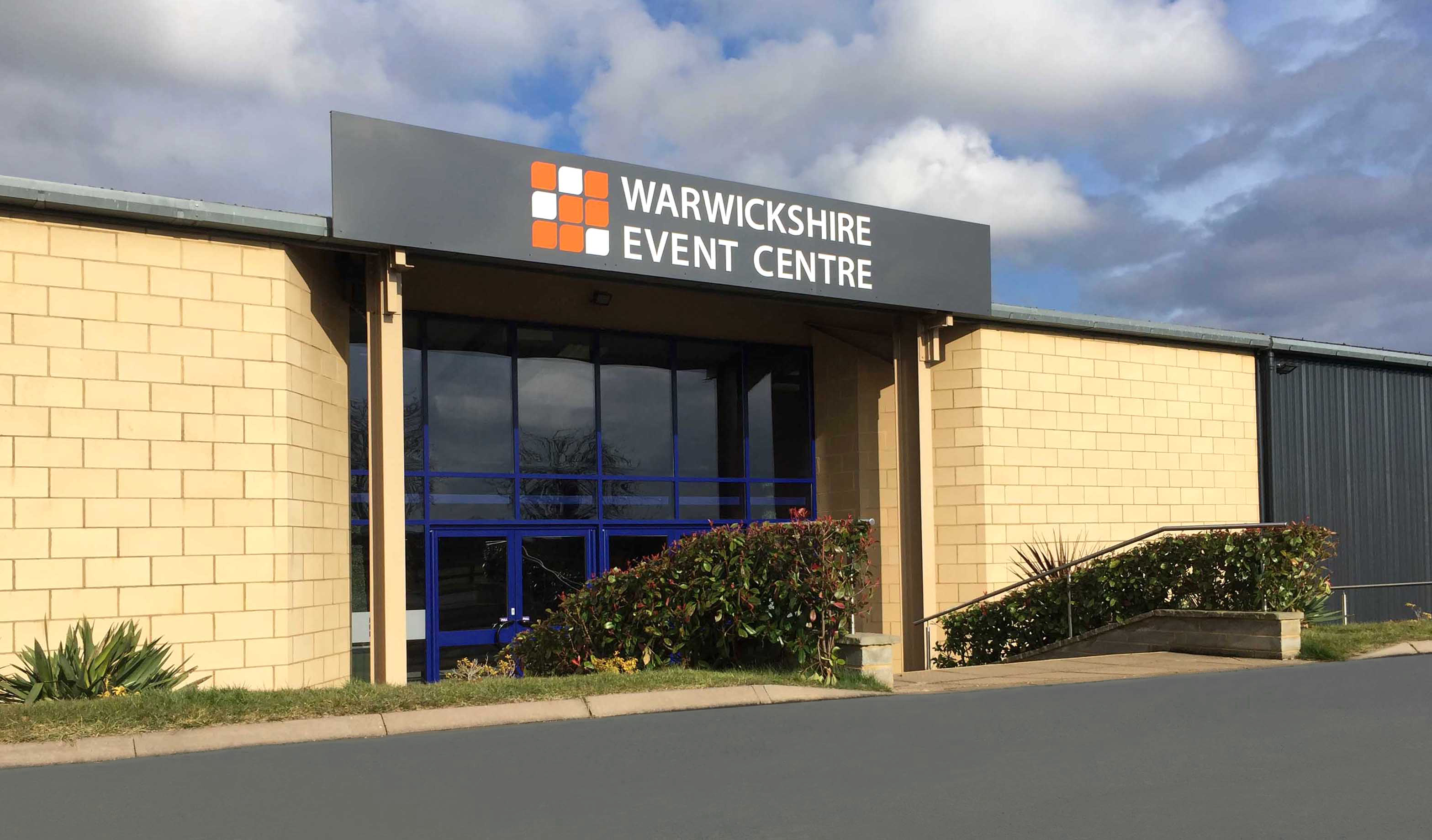Warwickshire Event Centre entrance with modern architecture, ideal for conferences and exhibitions.