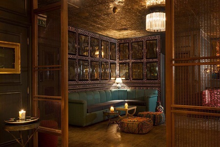 Stylish lounge bar with warm lighting, perfect for networking events and meetings.