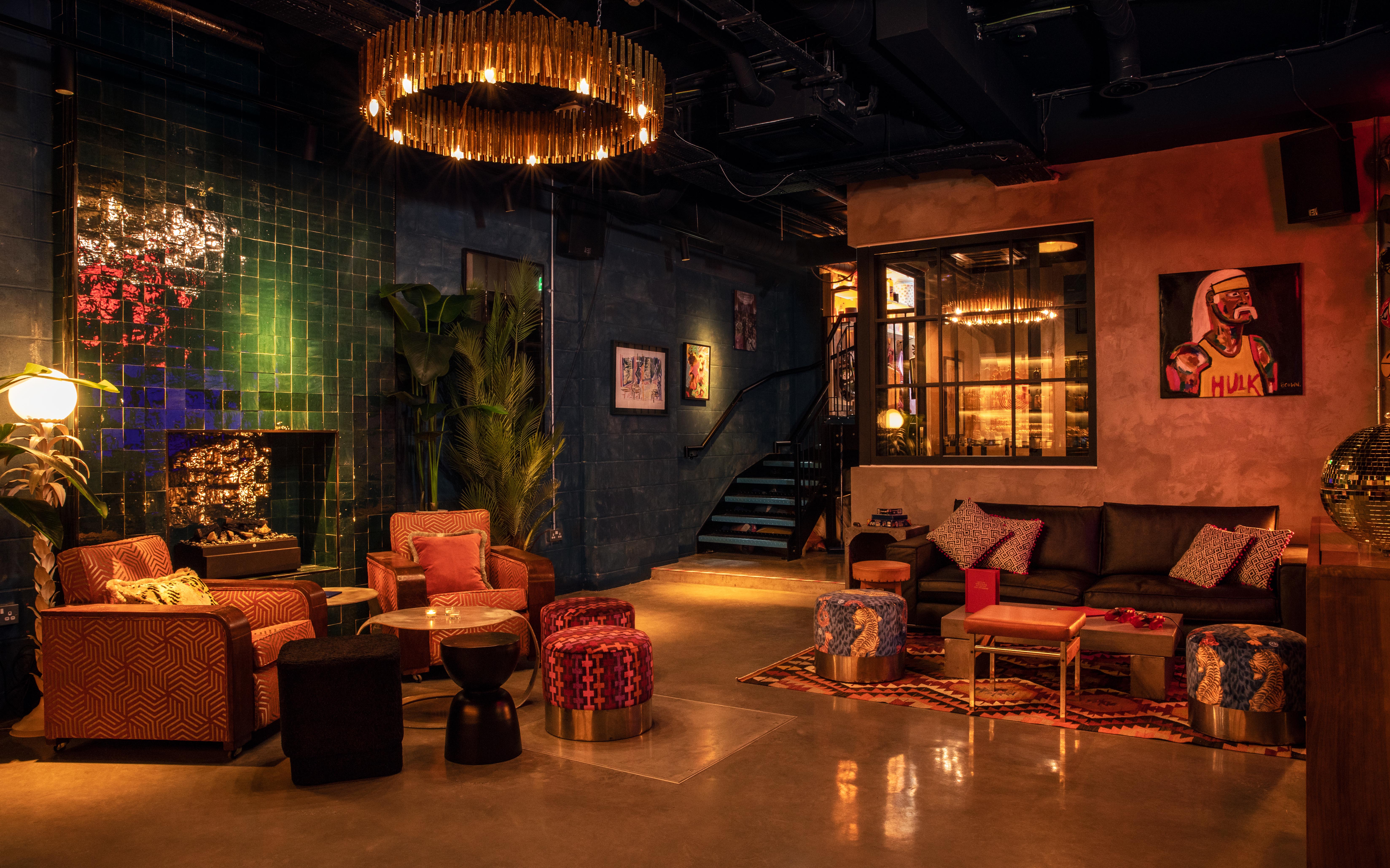 Stylish Basement Studio with warm lighting, ideal for creative events and gatherings.