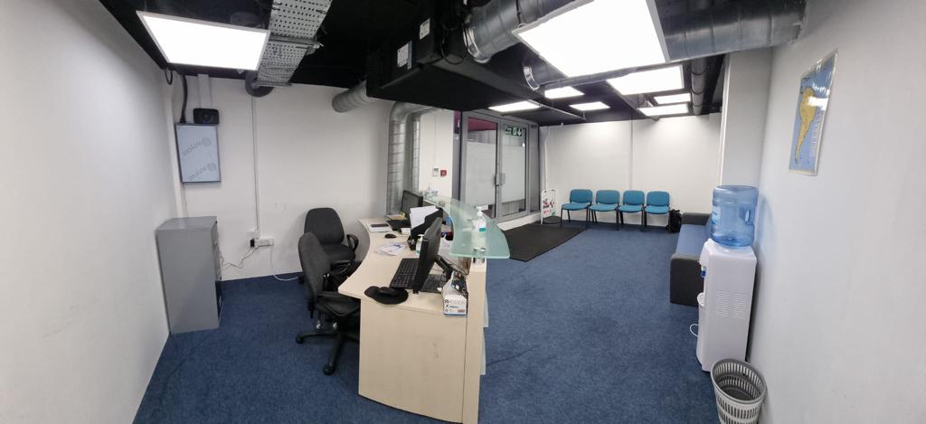 Modern meeting space with blue carpet, ideal for events and gatherings at D&S Support Center.