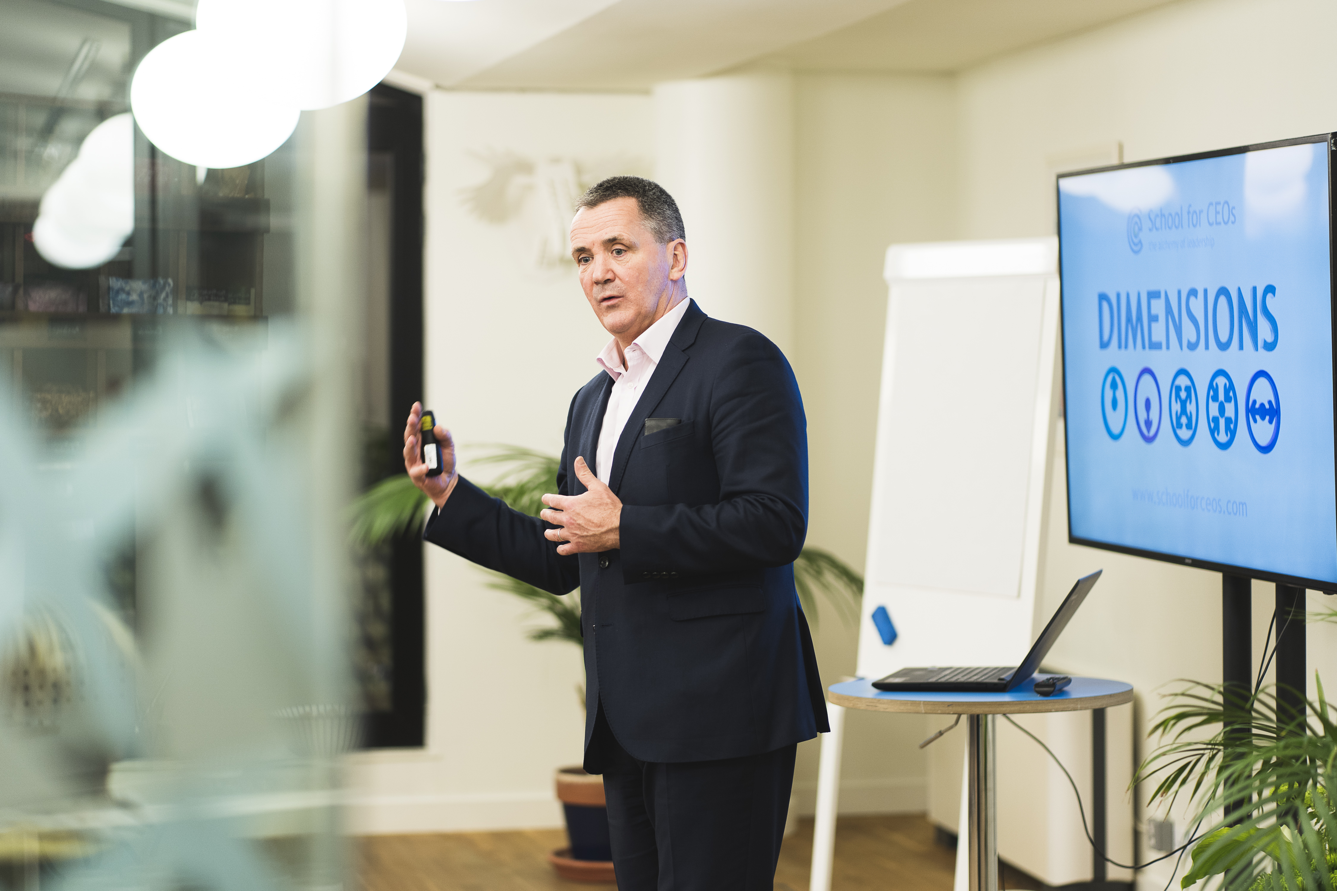Professional speaker engaging audience in modern meeting space at Clerkenwell Kitchen.