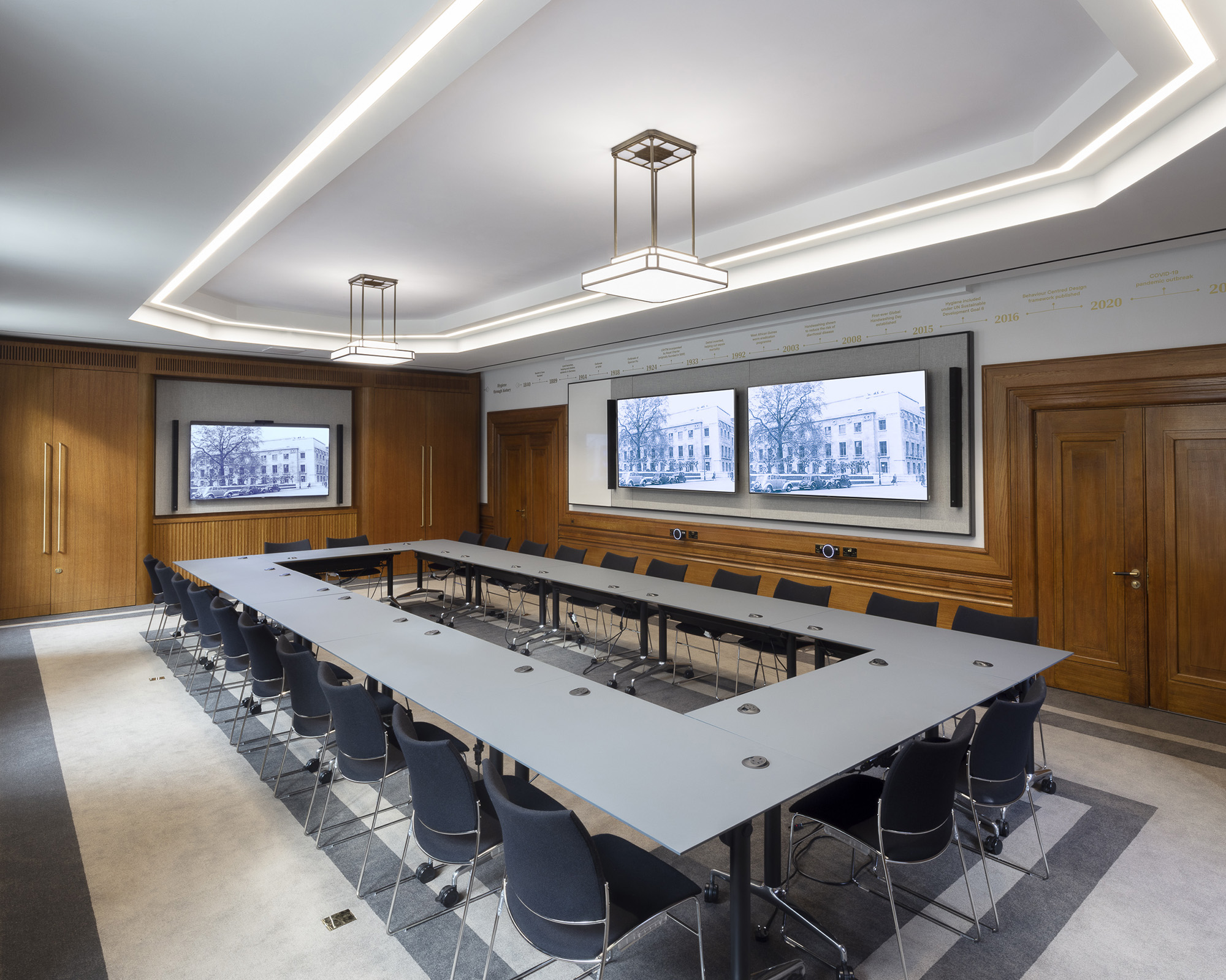U-shape boardroom with integrated AV technology for hybrid meetings and corporate events.