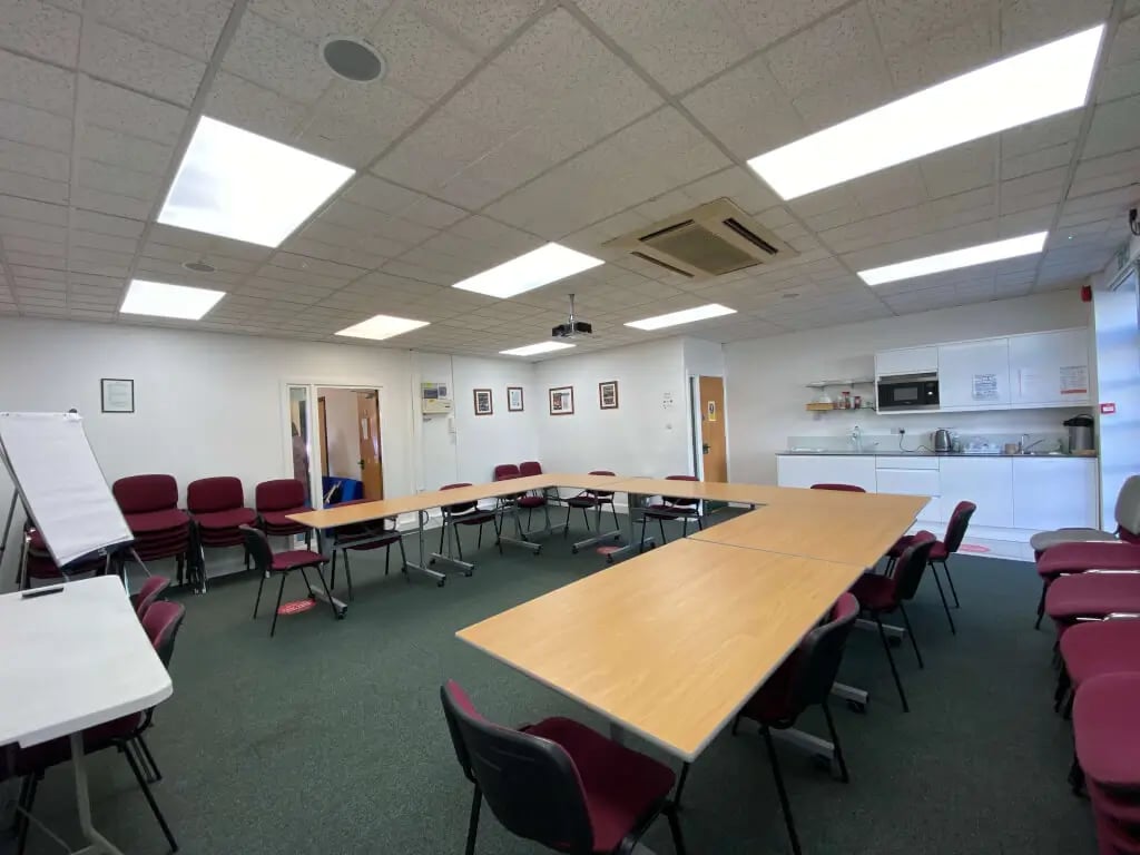 U-shaped conference room in EH Woolwich with kitchenette for budget meetings and workshops.