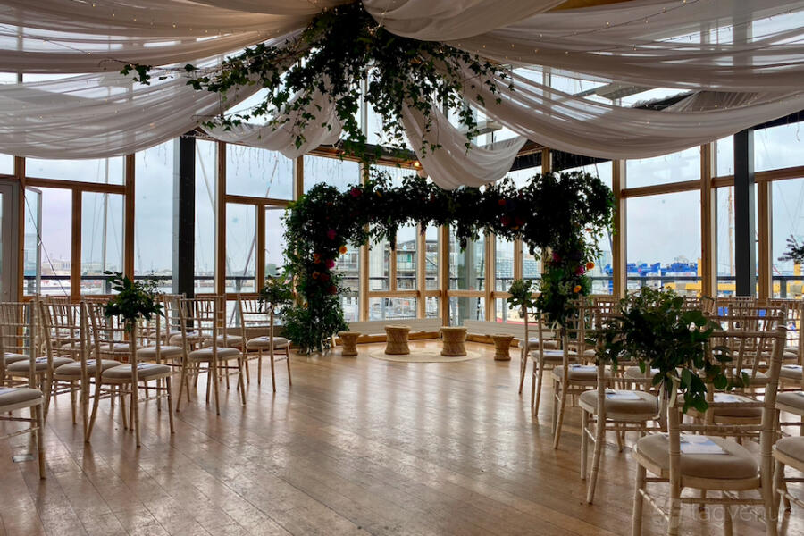 Open plan venue in EH Woolwich with elegant ceiling draping for intimate wedding ceremony events.