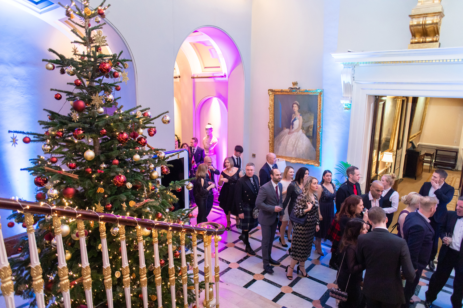Christmas party at 116 Pall Mall with a decorated tree, perfect for networking events.