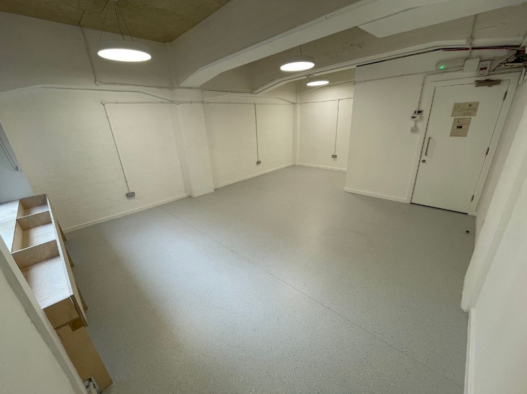 Minimalist meeting space at Vision Wharf Pop-Up for workshops and brainstorming sessions.