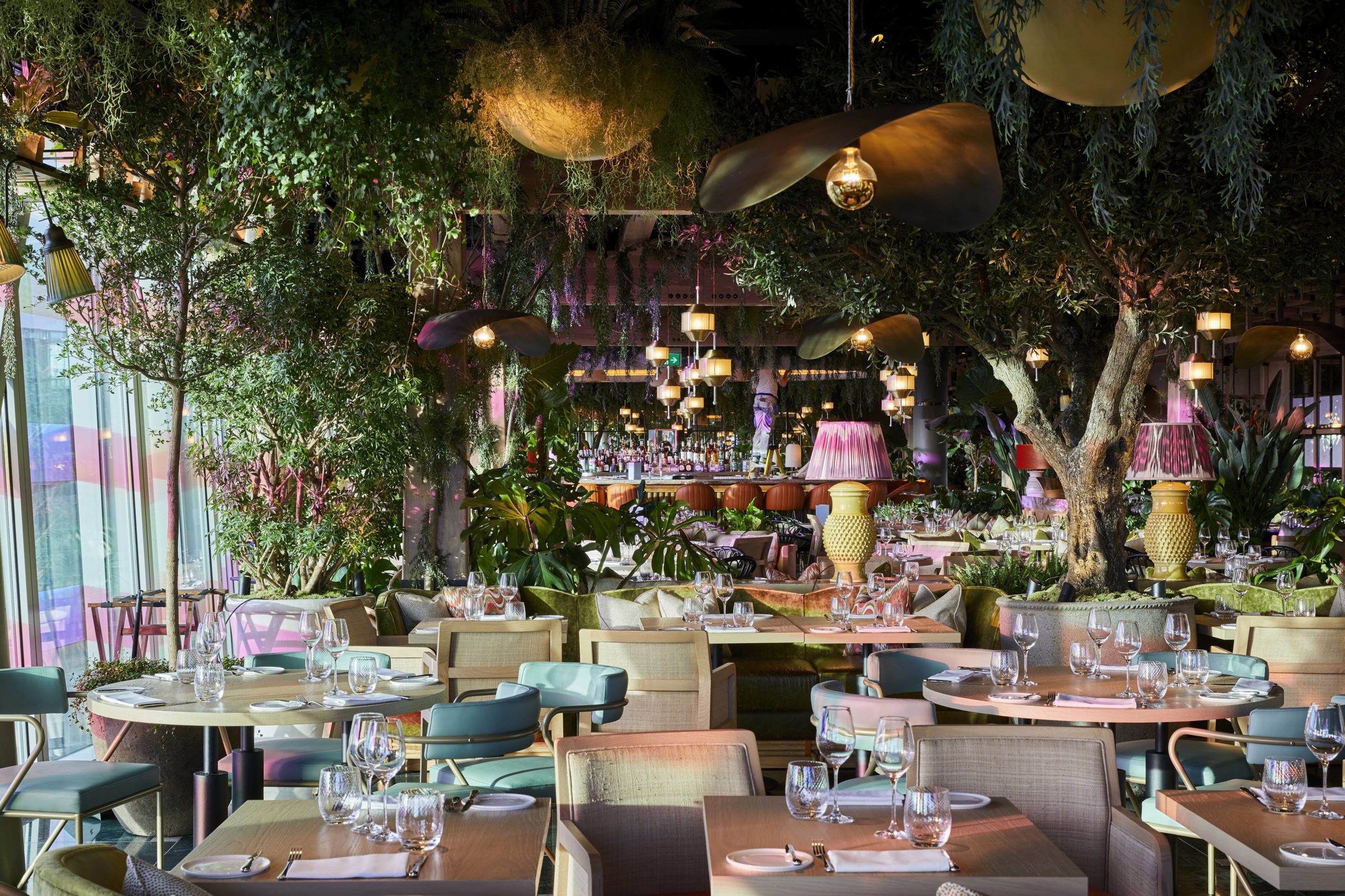 Lush restaurant venue with greenery, perfect for events and private dinners.