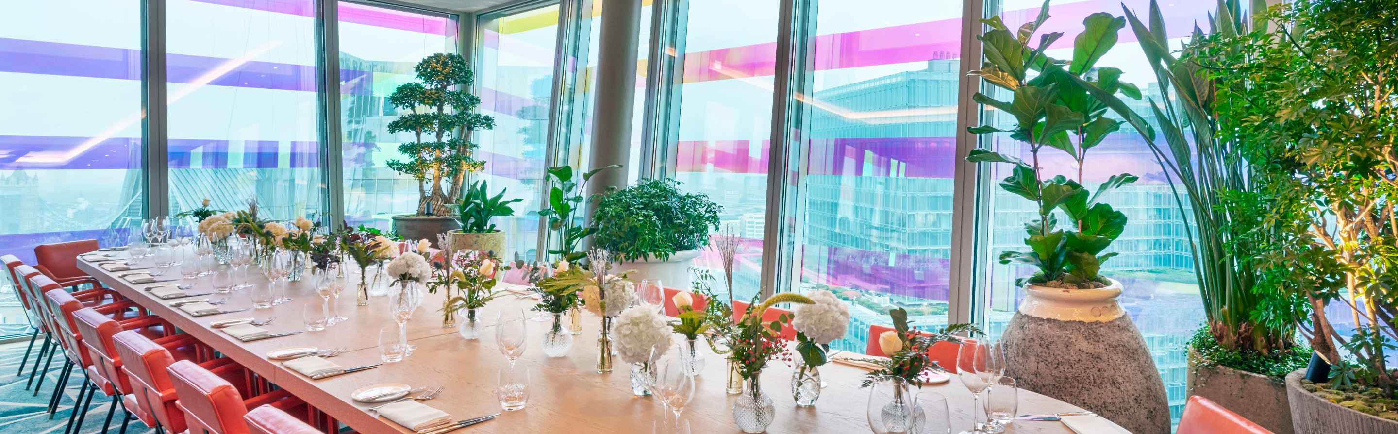 Private dining room with elegant table setting for corporate meetings and social gatherings.