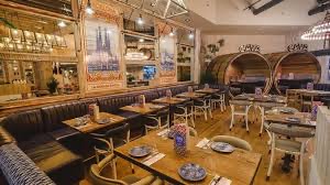 Stylish Tapas Revolution Restaurant with warm lighting, perfect for events and gatherings.