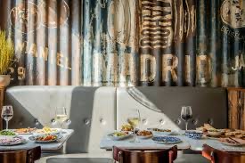 Tapas Revolution Brighton: vibrant dining space with rustic decor for events and gatherings.