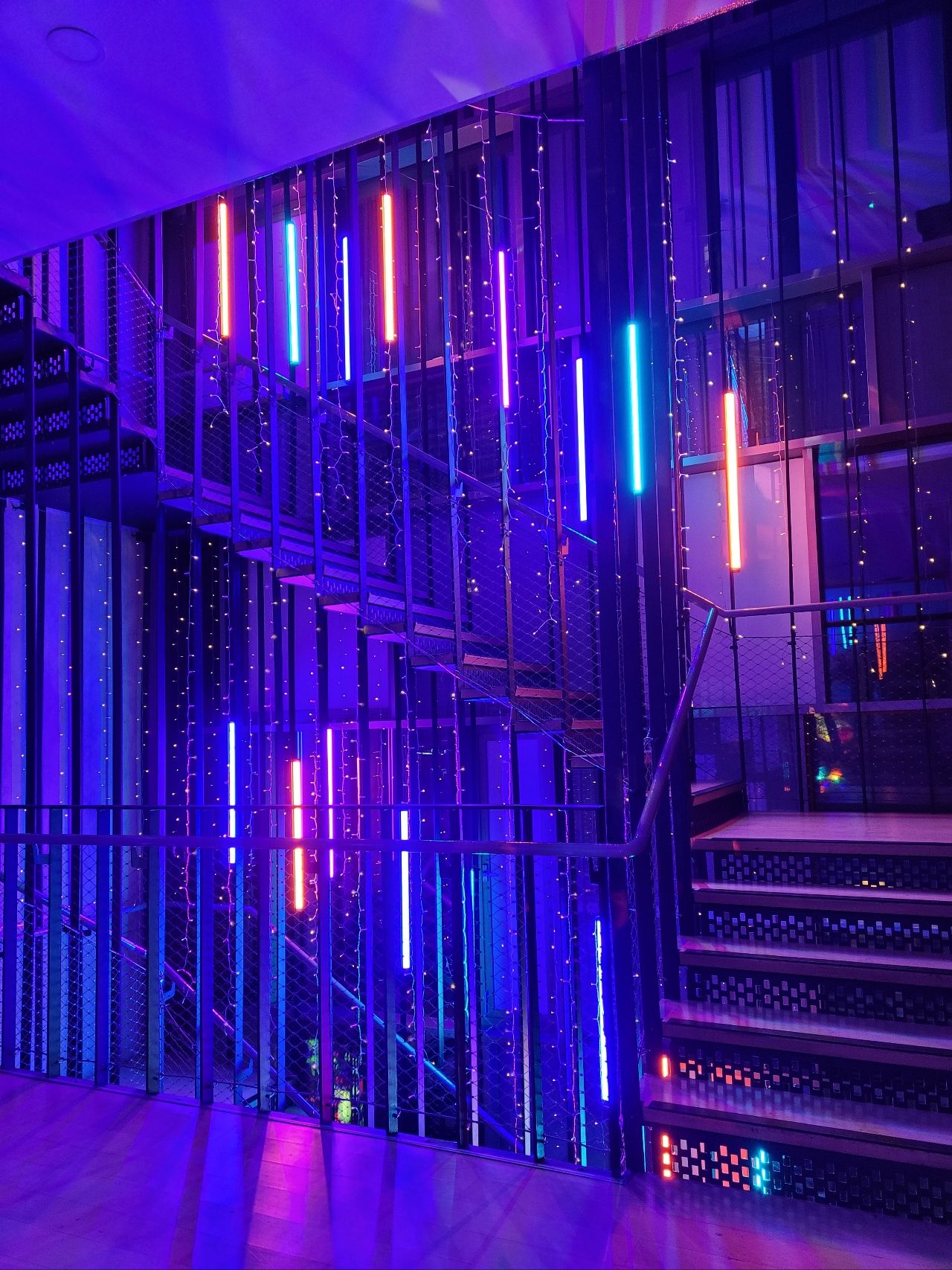 Vibrant LED-lit staircase in Siobhan Davies Studios, perfect for events and parties.