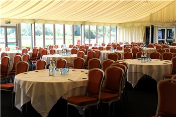 Whimbrel Marquee event space with round tables, ideal for conferences and banquets.