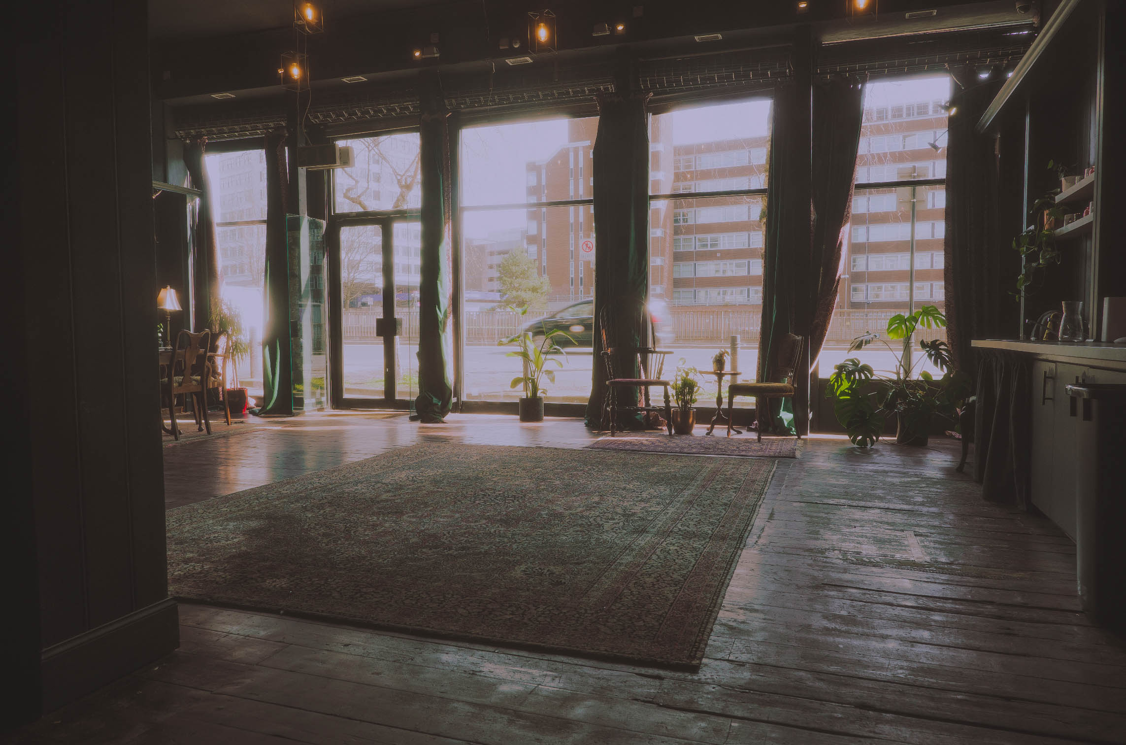 Versatile event space with natural light, ideal for gatherings and workshops.