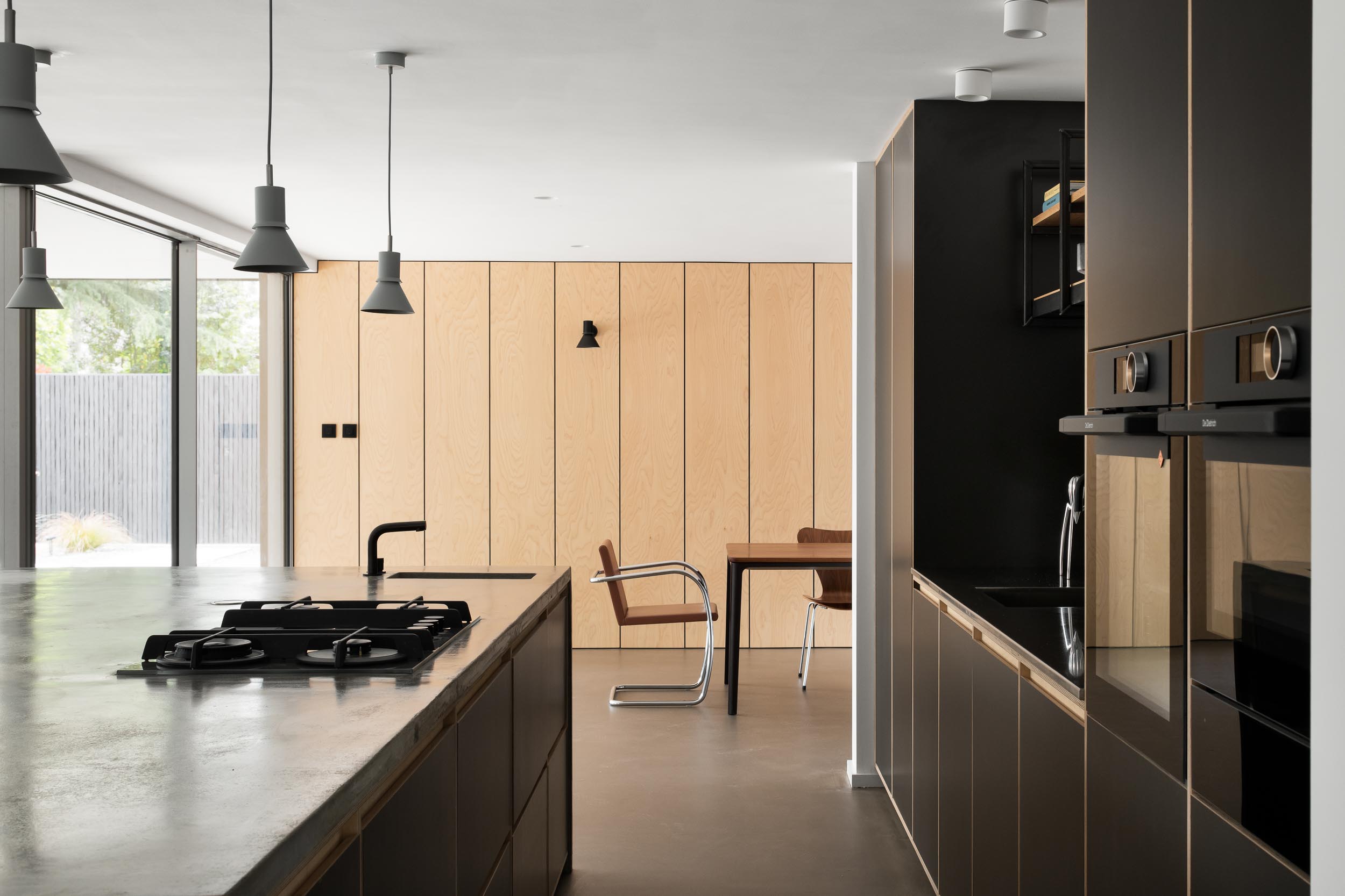 Modern minimalist kitchen in KuroKoti, ideal for intimate meetings and small events.