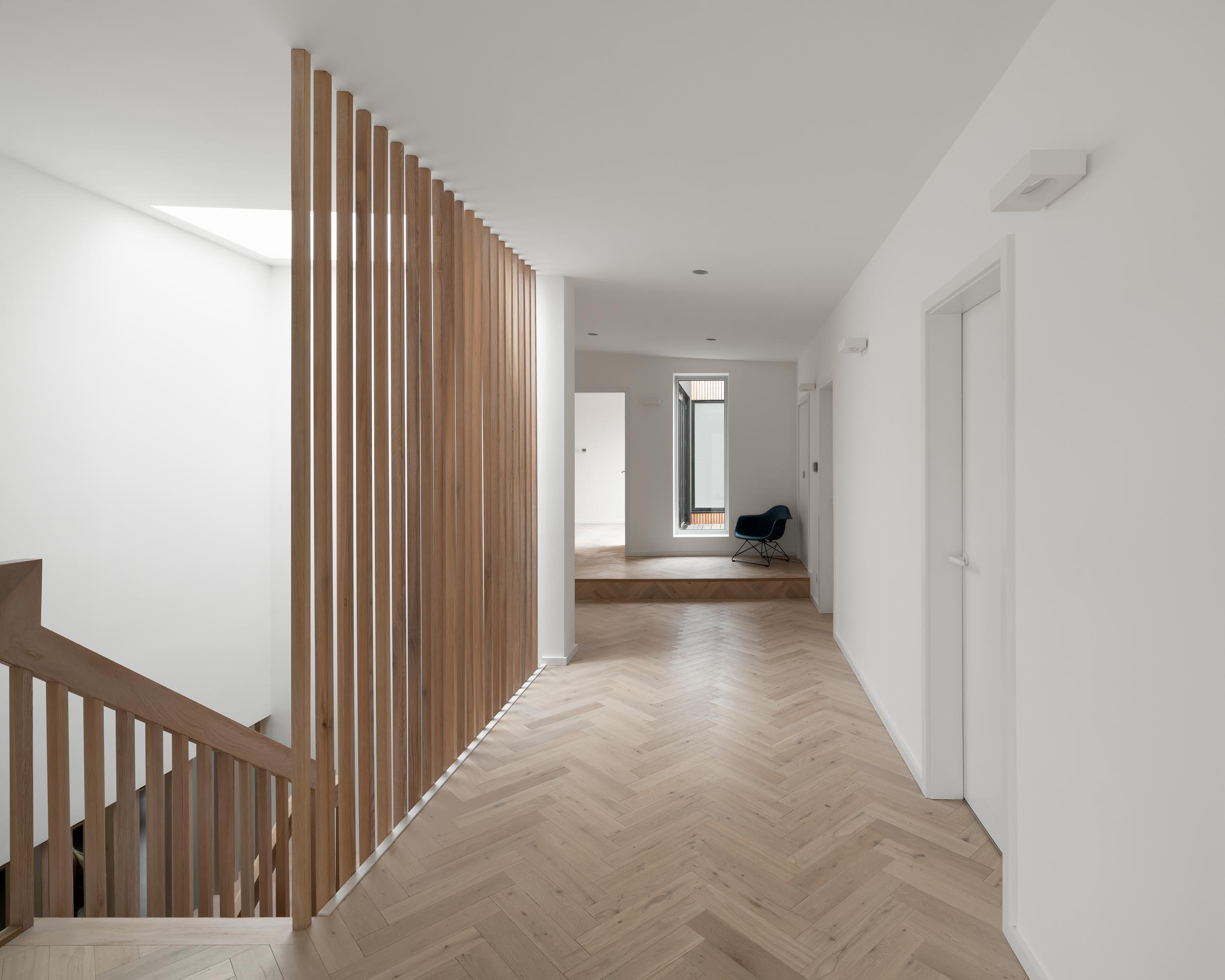 Modern minimalist hallway with wood accents, perfect for networking events and gatherings.