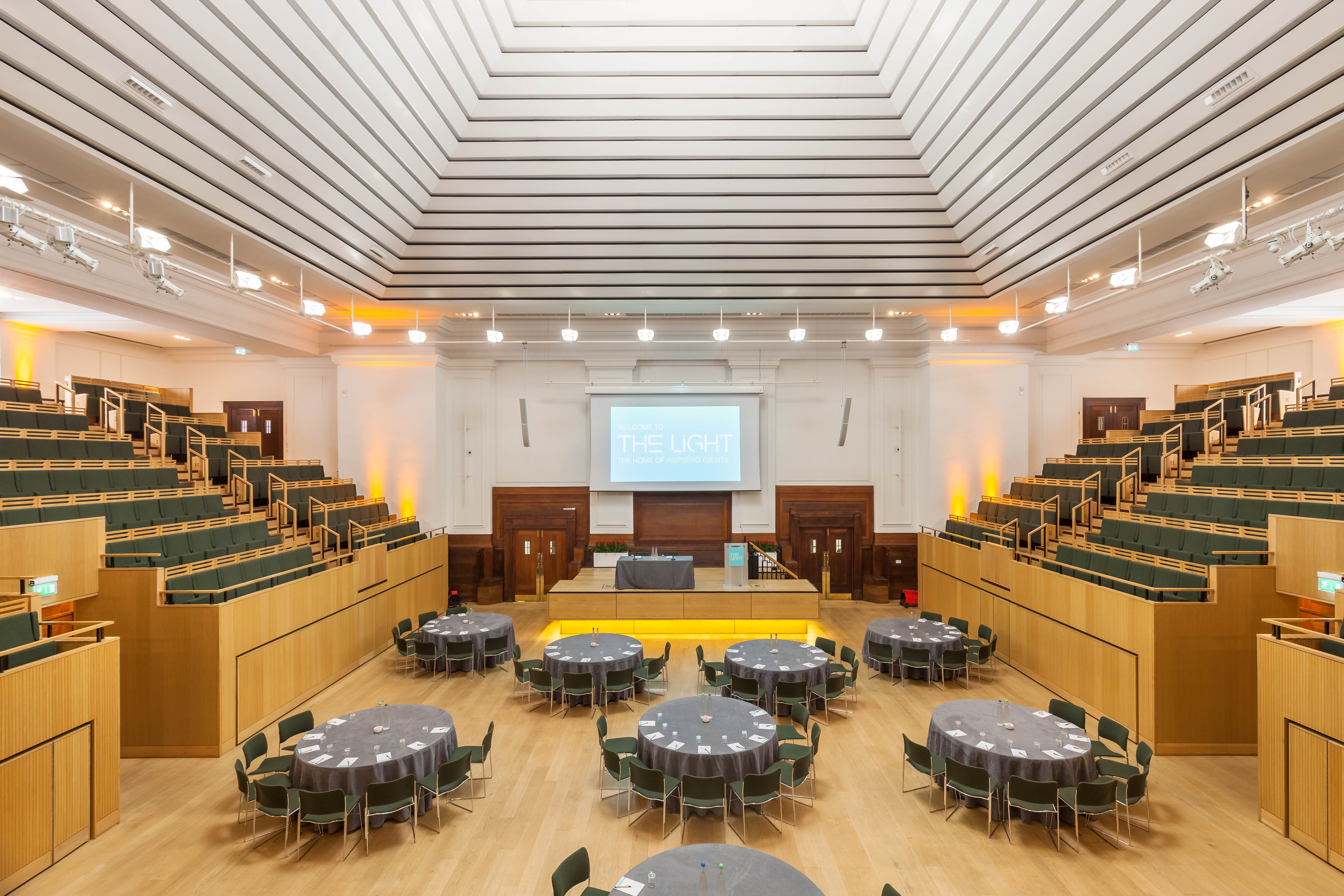 Versatile event space with tiered seating for conferences and workshops.