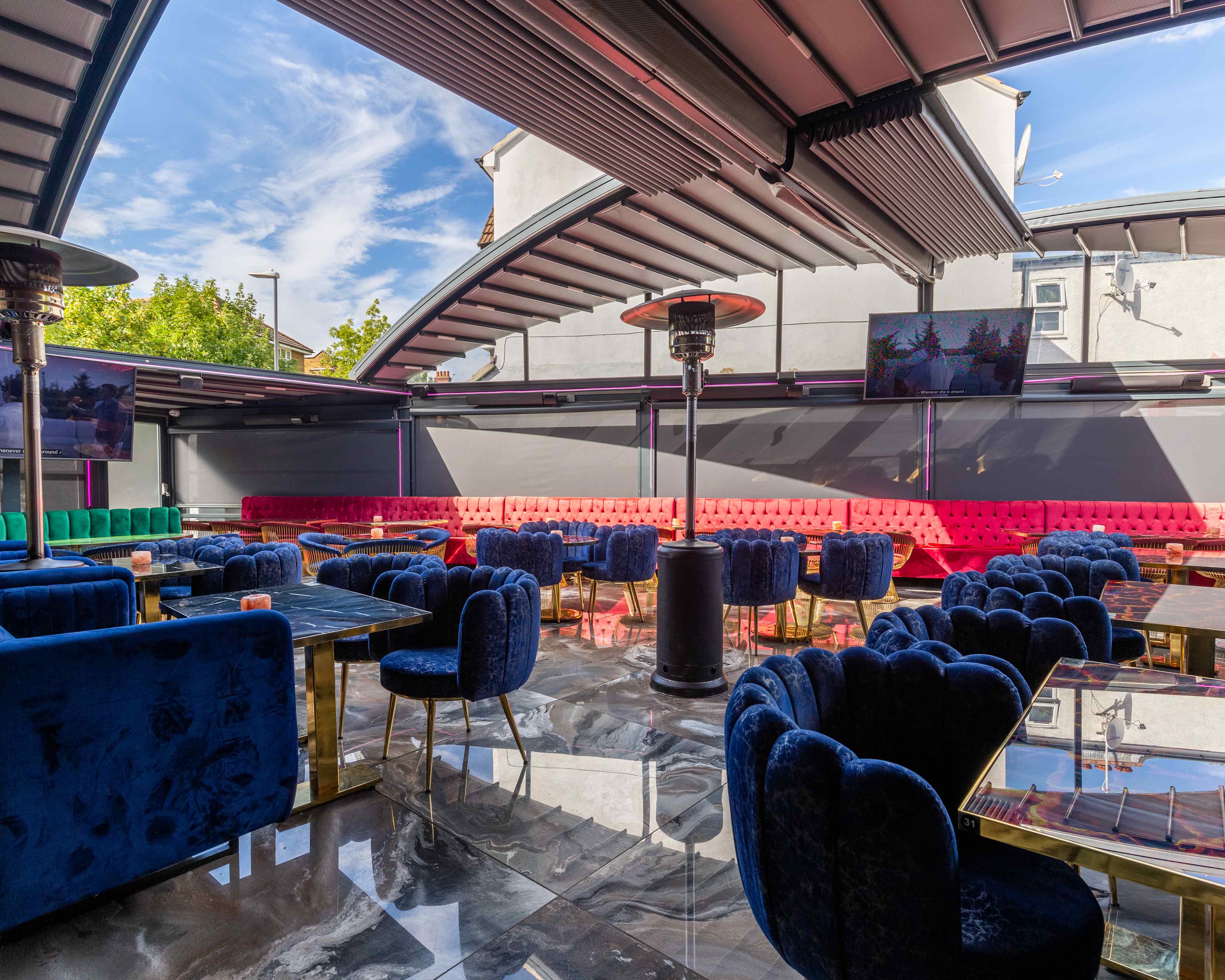 Stylish outdoor venue with vibrant seating, perfect for events and gatherings.